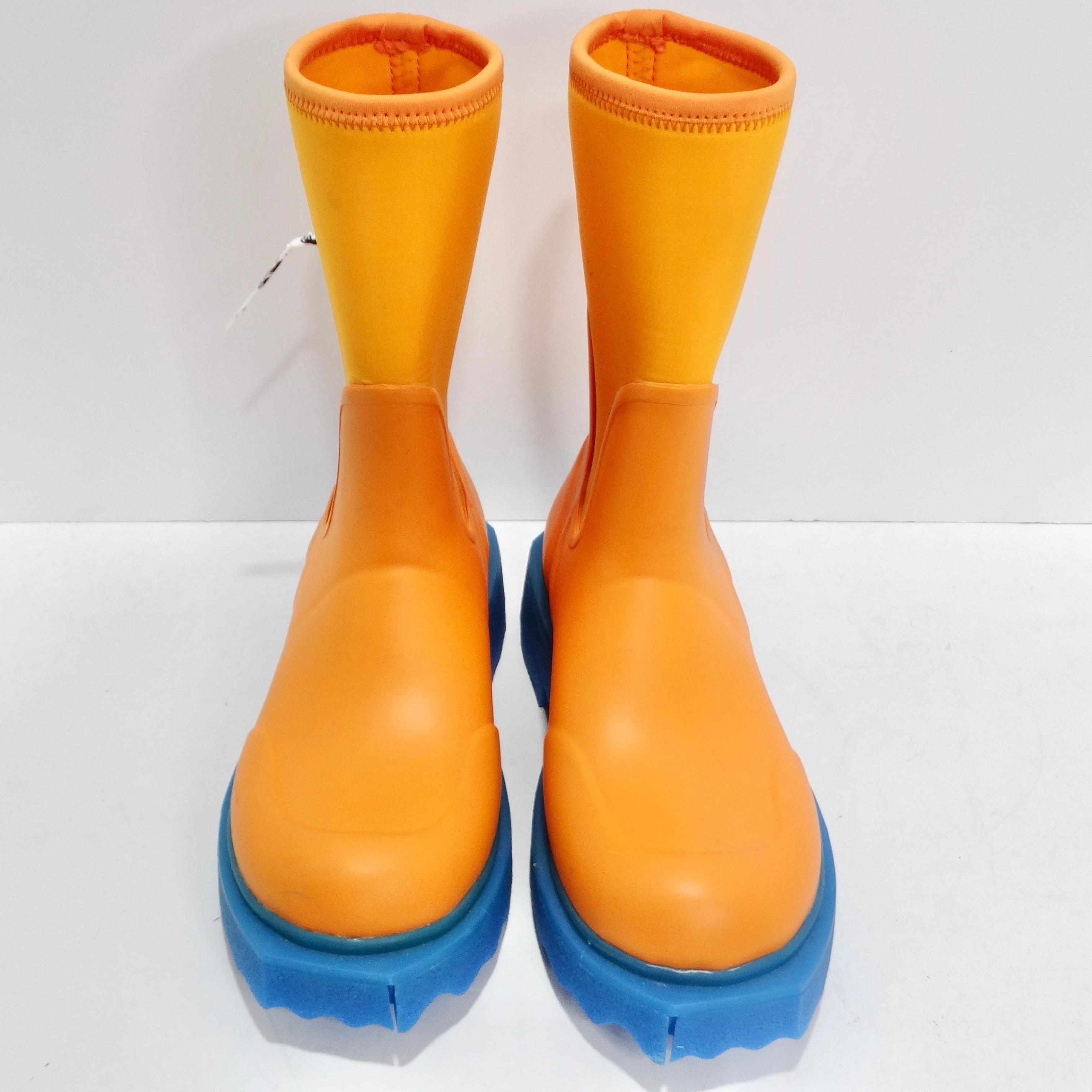 Get your hands on the Off-White Orange & Blue Rubber Boots—an edgy and playful addition to your footwear collection that defies convention and brings a burst of energy to rainy days. The boots feature a striking orange hue, instantly capturing