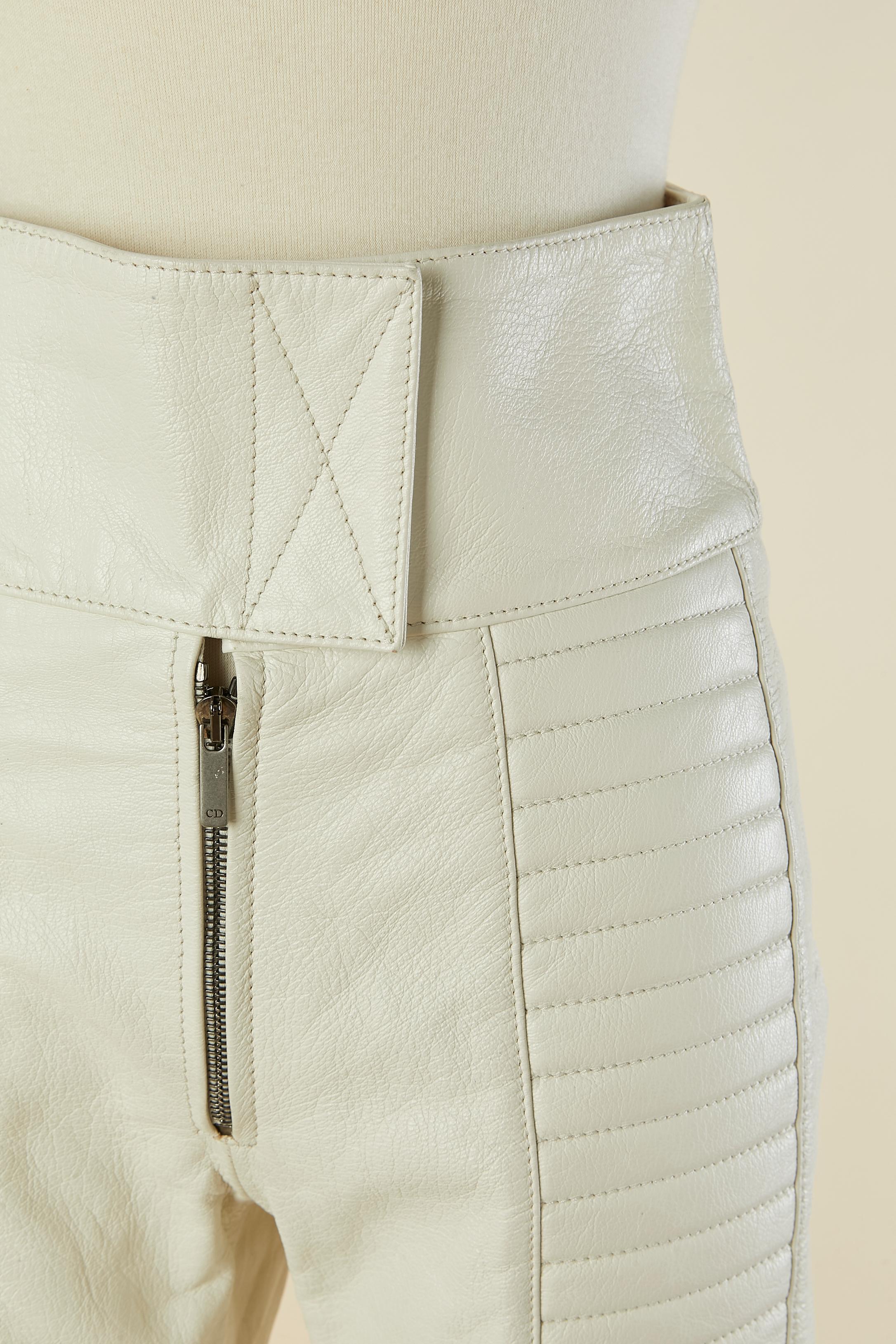 Off-white padded and top-stitched leather biker pant. Silk lining. Hook&loop and zip closure on the top middle front and on the bottom of the legs. Pocket on the back. 
SIZE 38 (Fr) M 
