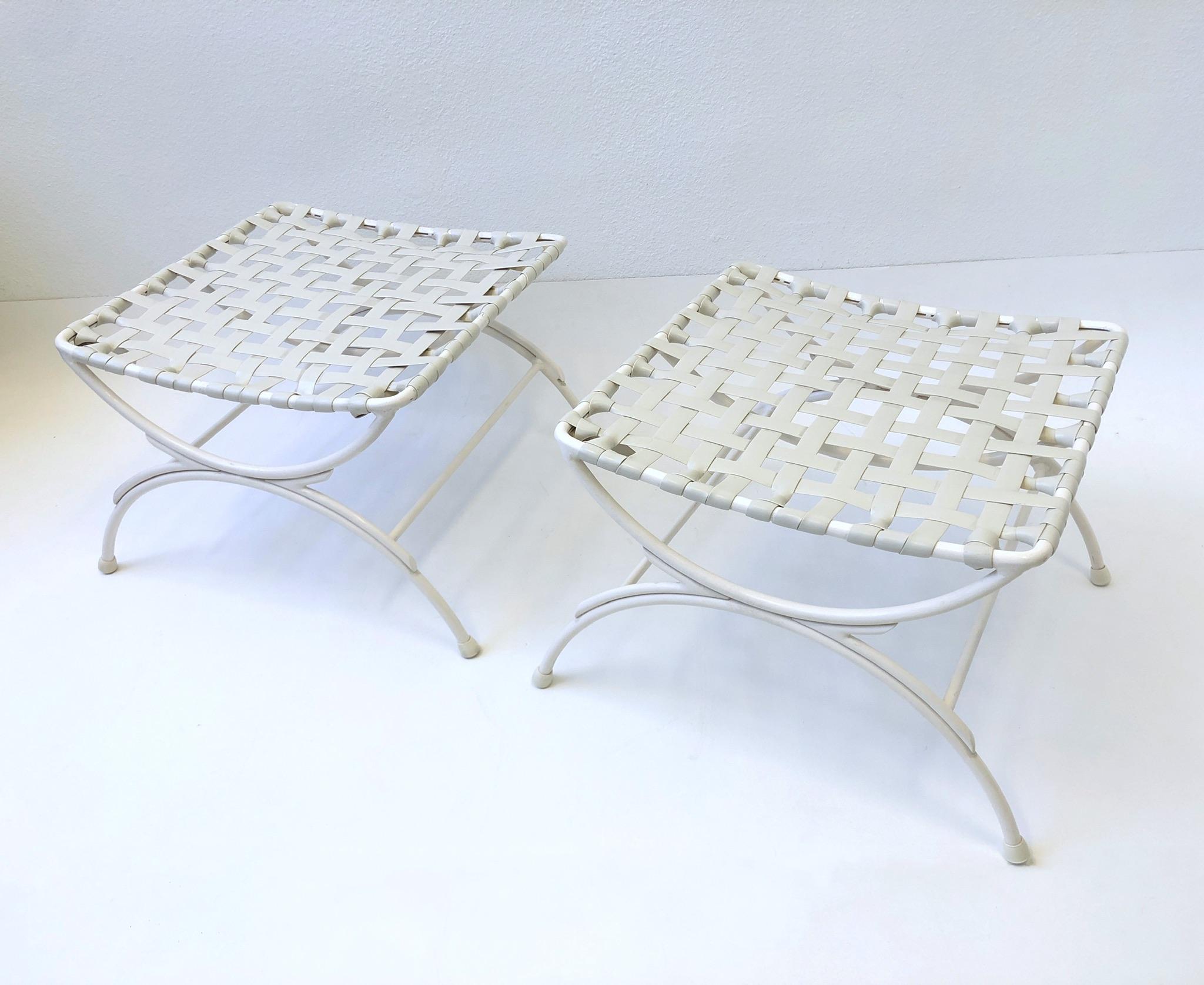 Pair of 1960’s off white lacquered aluminum and vinyl strapping design by Keller Scroll of Miami. 
Dining table and four chairs available also. 
This are in great condition with minor wear consistent with age. 
Measurements: 21” Wide, 20” Deep