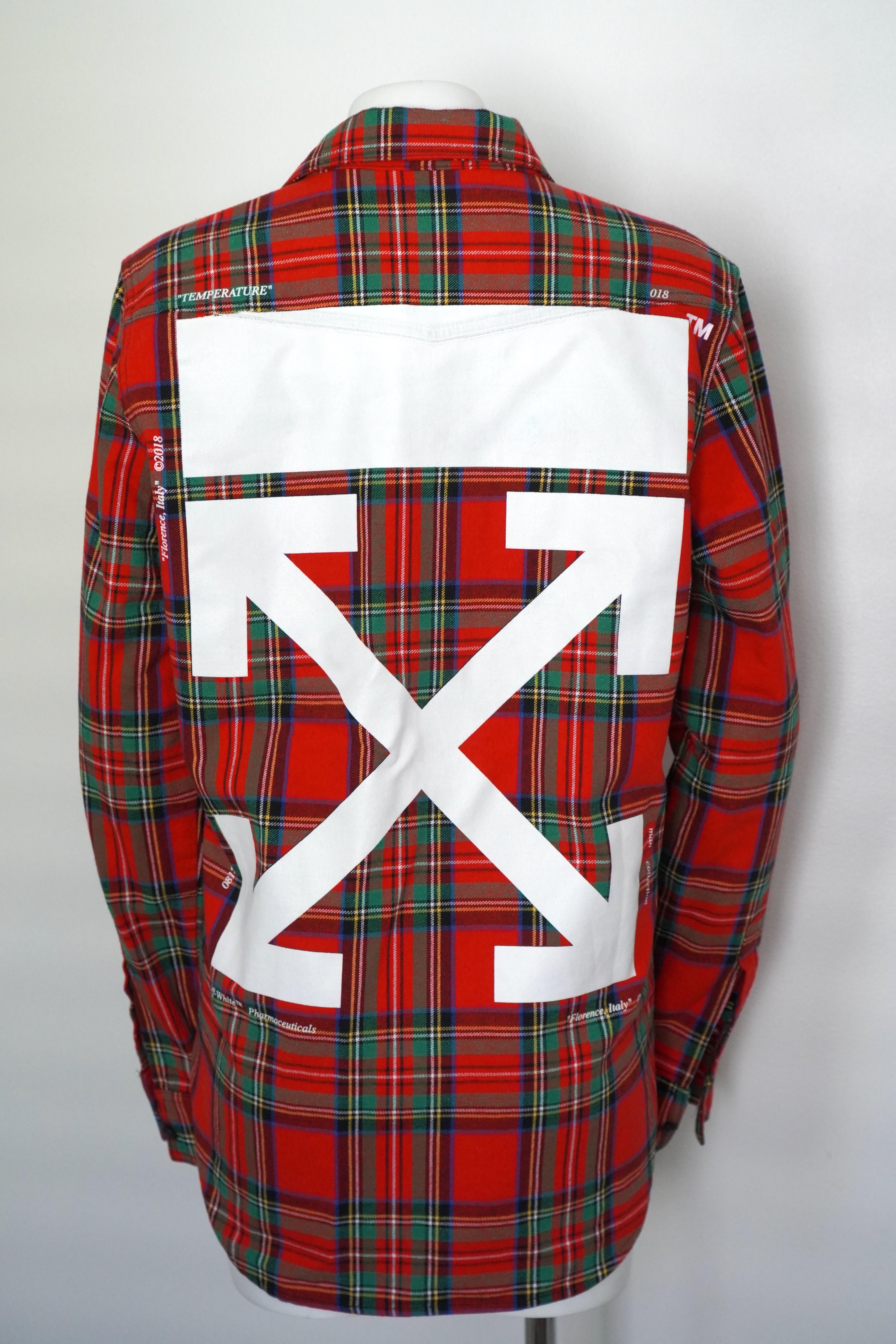 Off-White Red Plaid Flannel
Size M
Unisex
Front pocket detail
7 button front closure
Logo and details on the back
Total length is 31 inches.

This Off-White red plaid flannel is a classic wardrobe staple with a touch of urban flair. The vibrant red