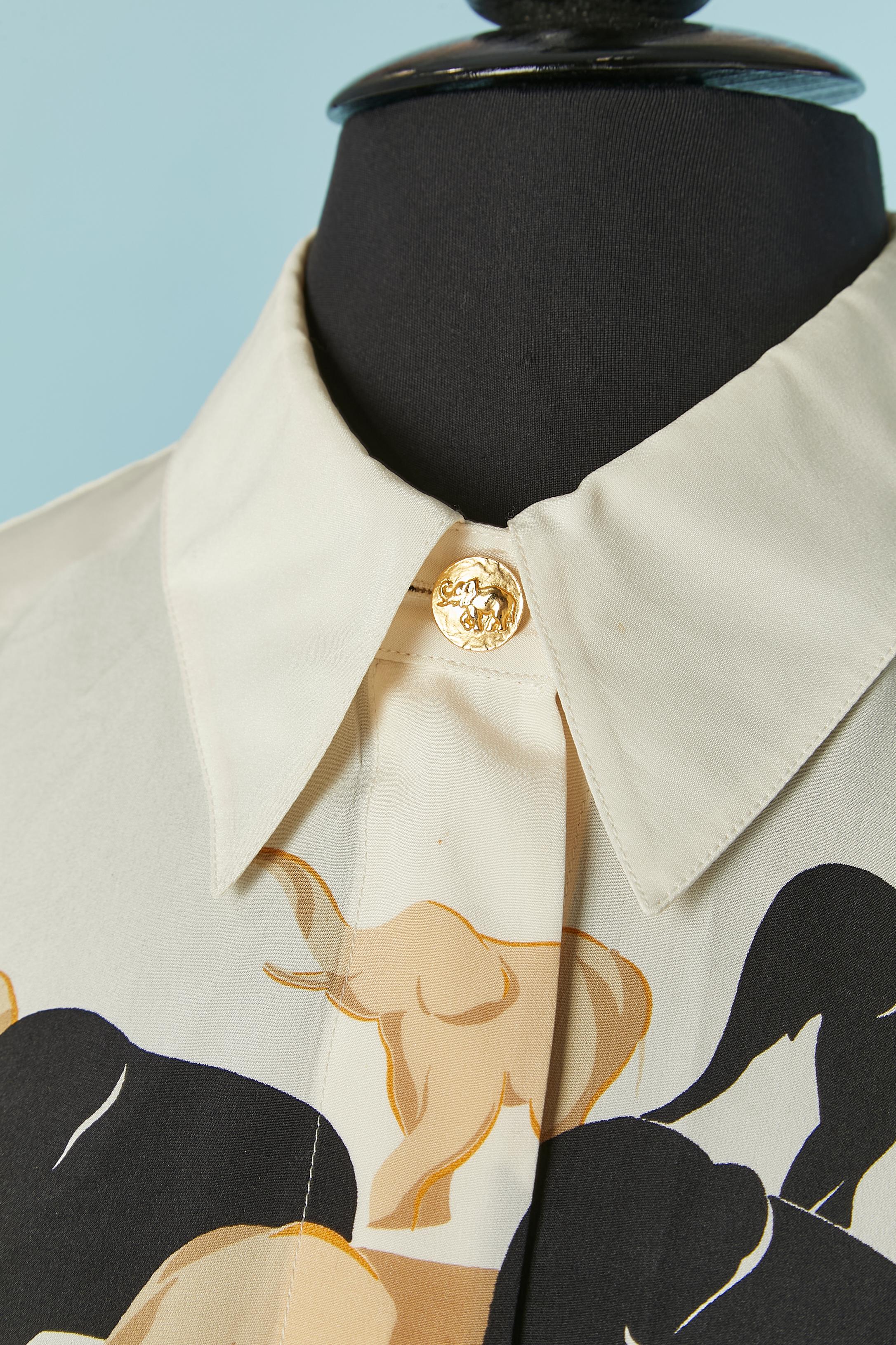 Off-white silk shirt with elephant print and button ( only on the top middle front and on the cuffs) Other hidden button are made of mother-of-shell. Shoulder pad ( damaged) 
SIZE 40 on tag / L 