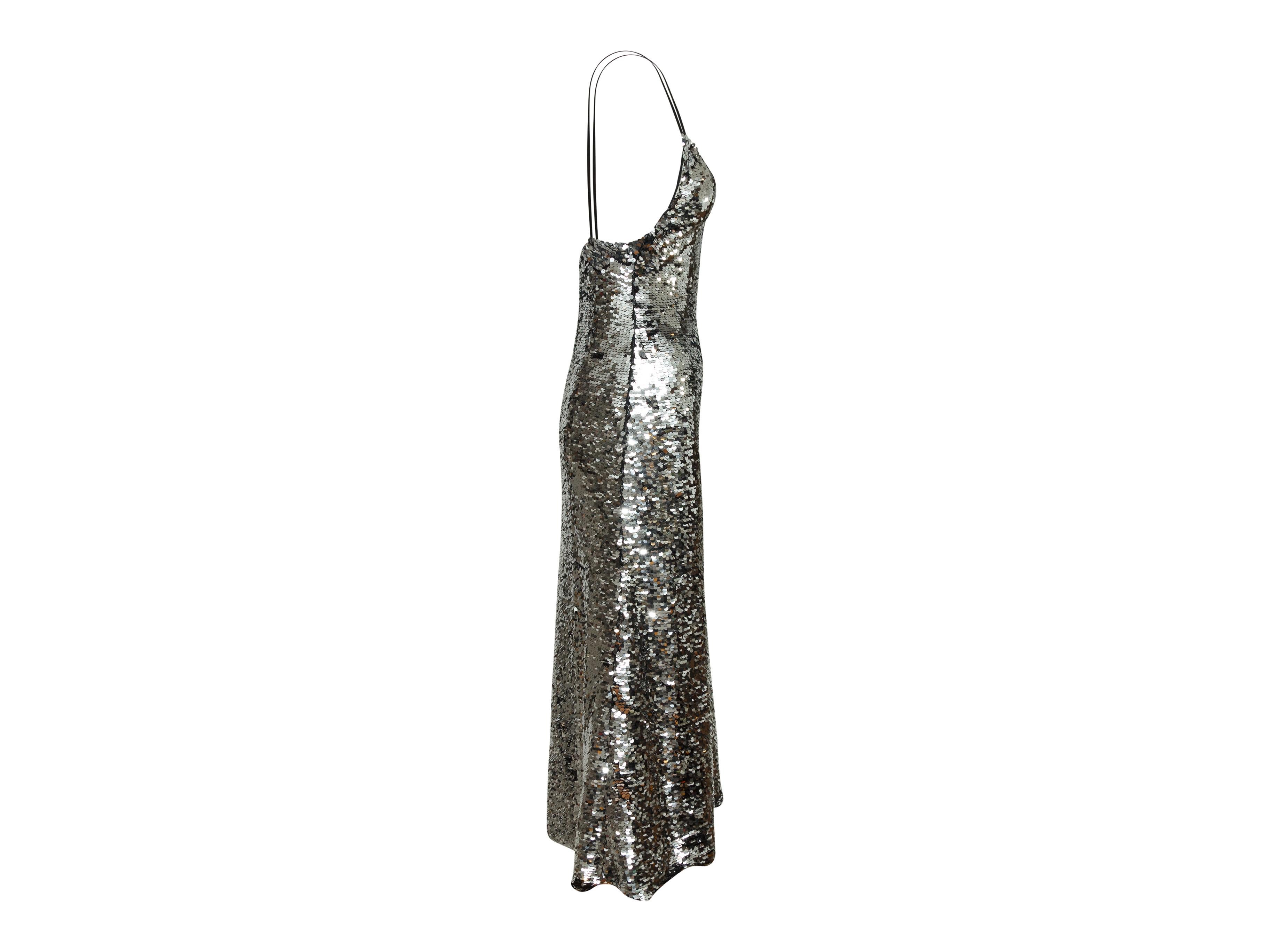 Product details: Silver metallic sleeveless evening dress by Off-White. V-neck. Sequin embellishments throughout. 29