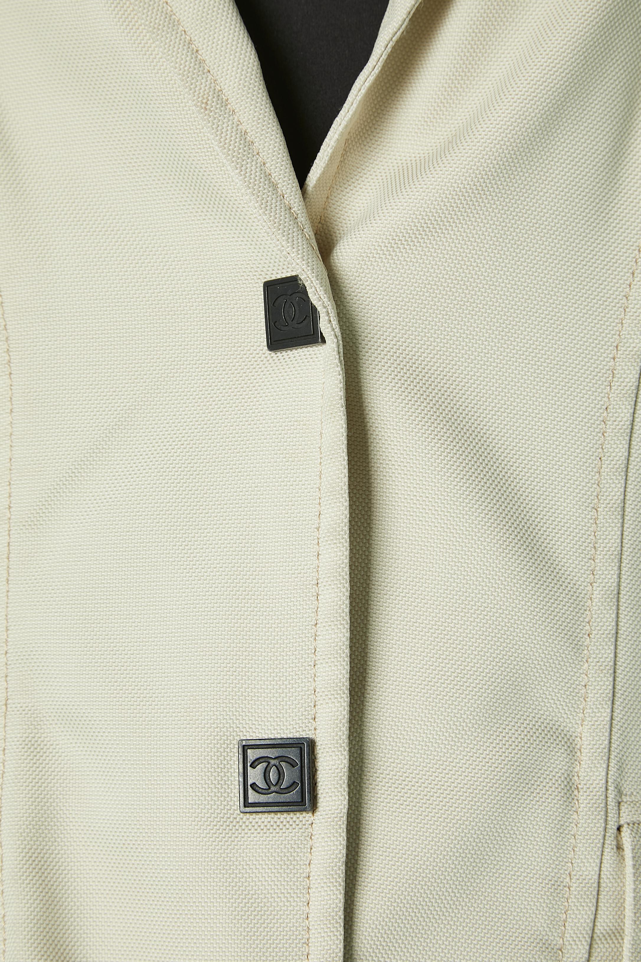 Off-white single-breasted jacket with branded snaps and piping . Fabric composition: 100% polyamide 
Top-stitched and cut-work. Pockets on both side. 
SIZE 42 (Fr) 12 (US)