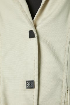 Off-white single-breasted jacket with branded snaps and piping Chanel