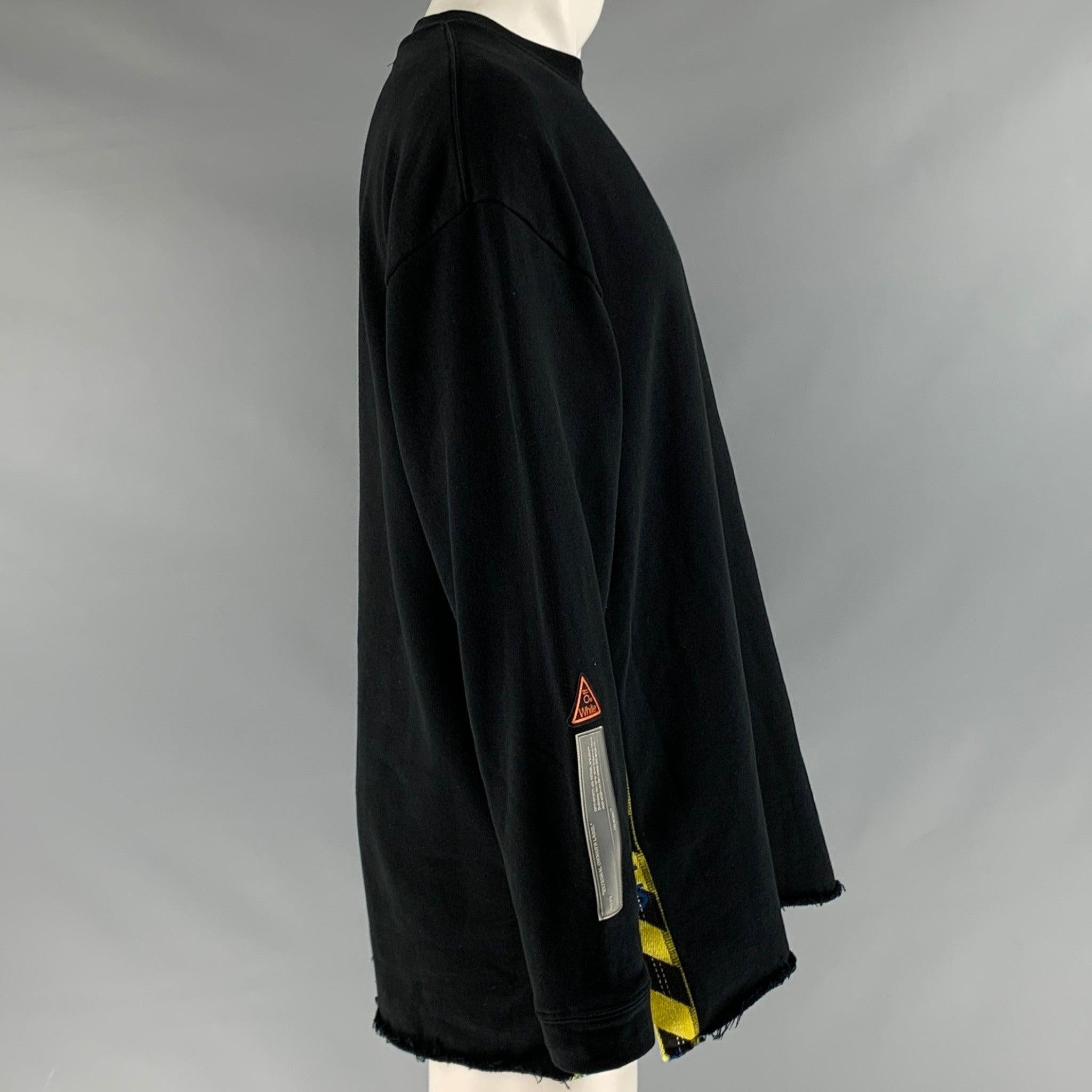 OFF-WHITE sweatshirt
in a
black cotton fabric featuring yellow ribbon side details, raw edge hem, right sleeve appliques, and a crew neck. Made in Portugal.Excellent Pre-Owned Condition. 

Marked:   S 

Measurements: 
 
Shoulder: 24.5 inches Chest: