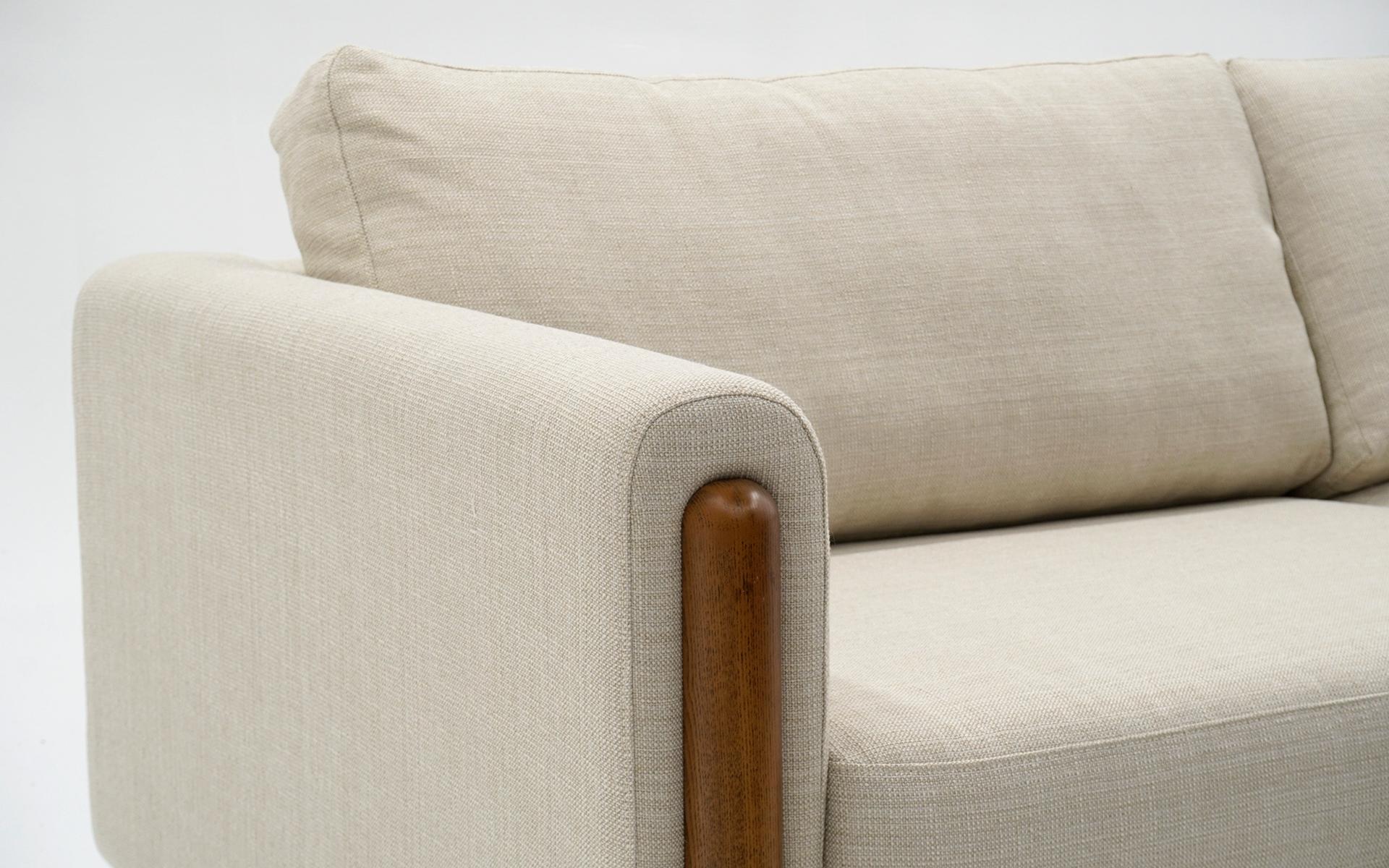white couch with wooden legs