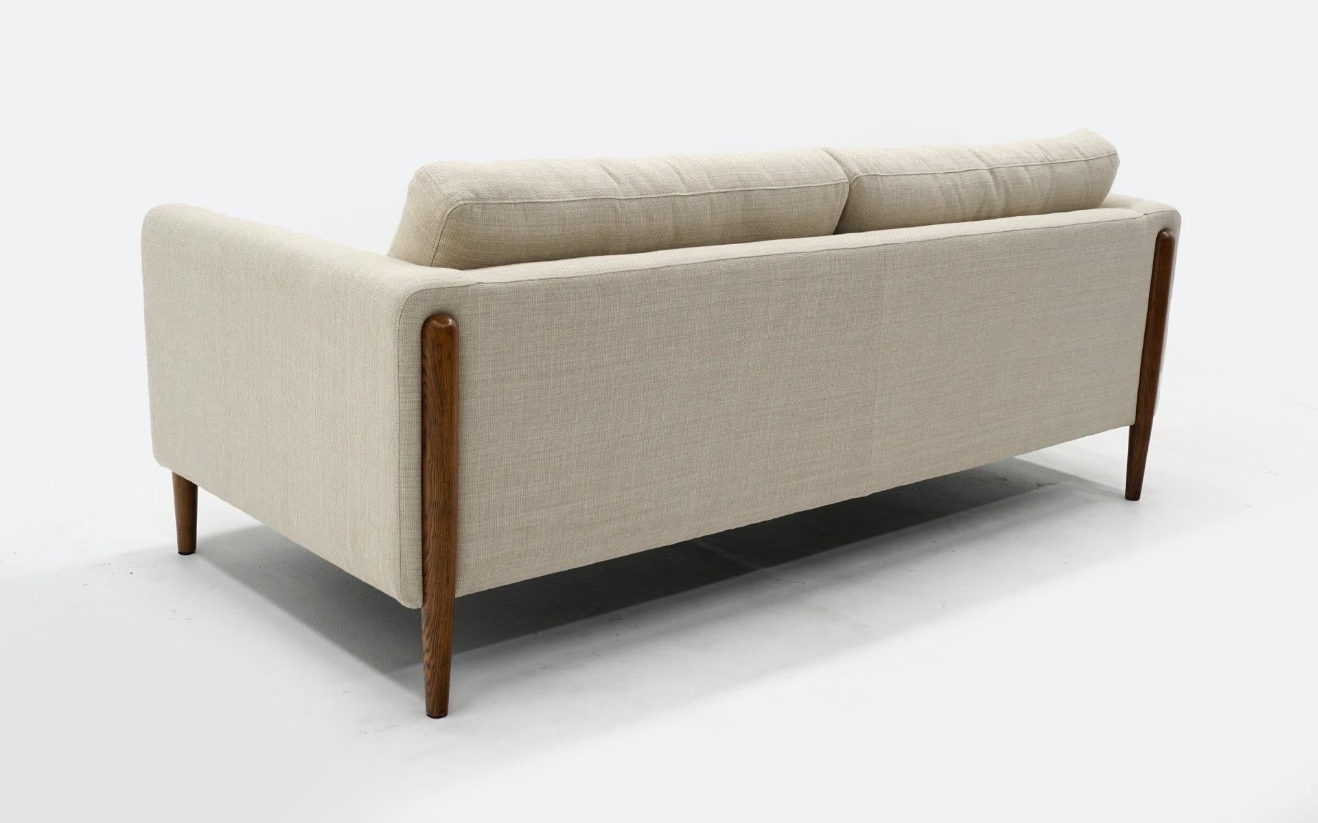 Off White Sofa with Walnut Legs by Nuevo, Almost New In Good Condition In Kansas City, MO