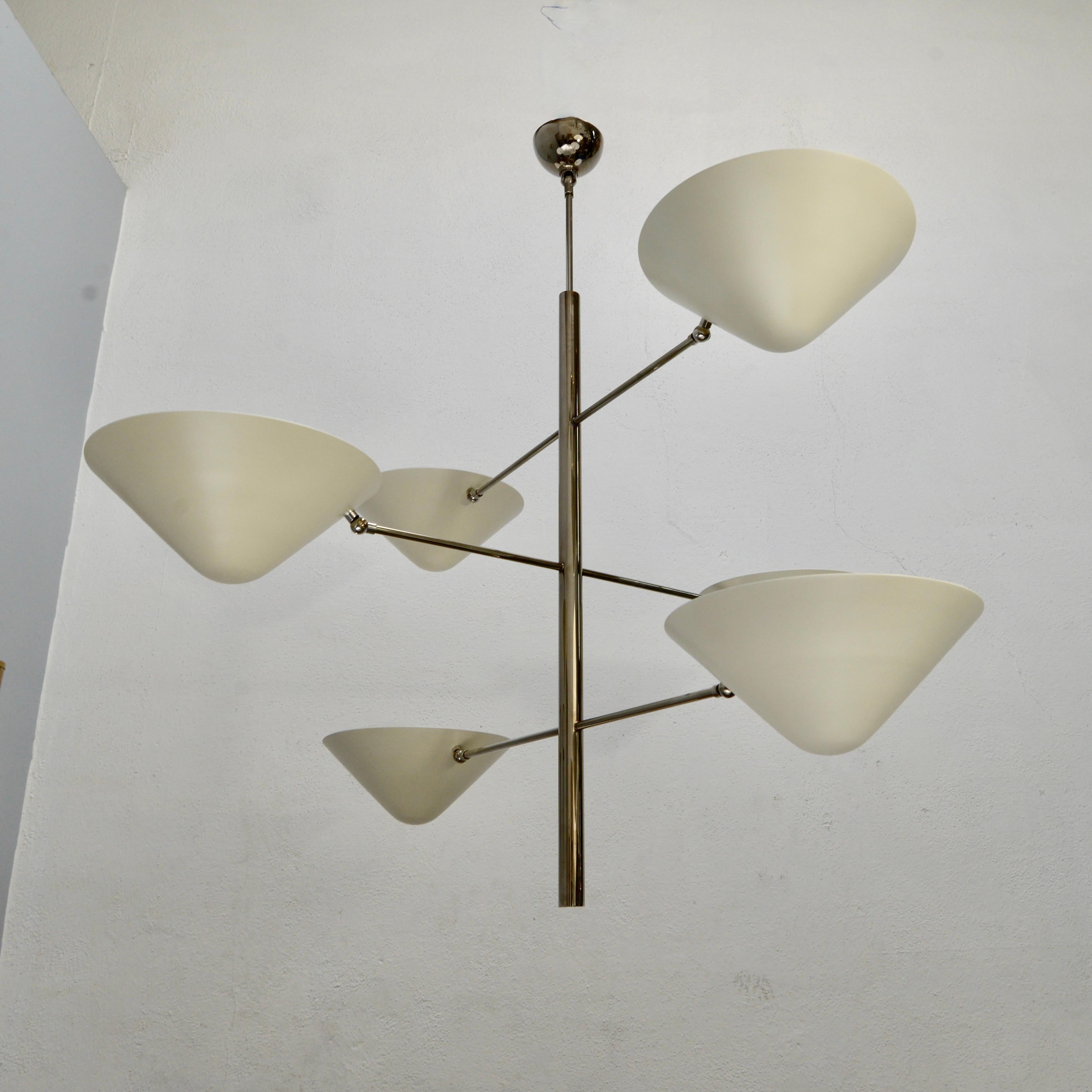 Organic inspired chandelier that combines geometry with botanical aspects. Having six top open shades for indirect lighting. A single medium based E26 socket per shade. Made in custom sizes, but standards are listed.
Aged silver finish. Made to