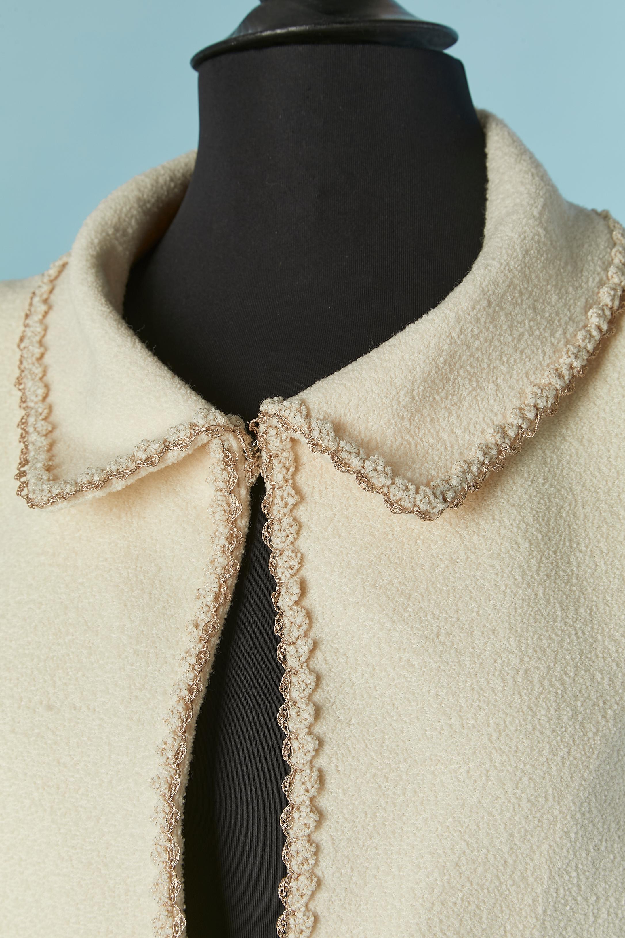 Off-white tweed edge to edge jacket with braids edge. The fabric composition tag has been cut but the tweed is probably mixed cotton . The branded lining is in silk. 
One branded button and buttonhole closure on the middle front. 
Pocket on both