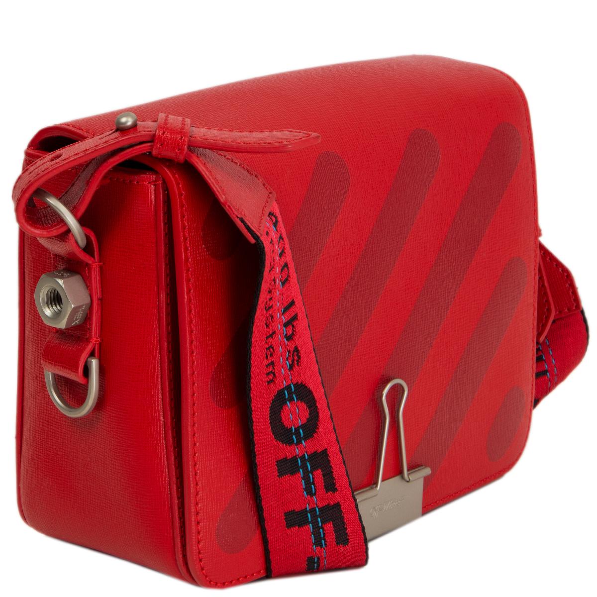 100% authentic Off-White c/o Virgil Abloh Diag Flap Bag in red textured leather accented with a red and black jacquard shoulder strap. Opens with a magnetic button and is lined in black grosgrain fabric with one zip pocket against the back and one