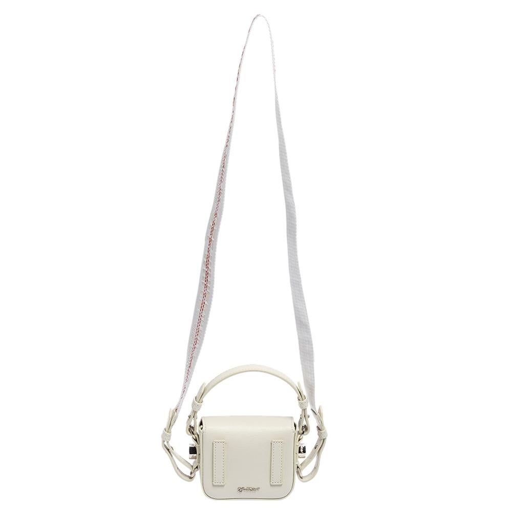 Designed by the iconic fashion label, Off-White, this crossbody bag deserves to be appreciated for its contemporary style and outstanding features. This bag is made using white-black diagonal-striped leather on the exterior with silver-toned accents