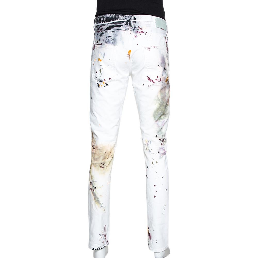 Tailored from cotton, these Off-White jeans are designed in a slim-fit silhouette. This white denim features five external pockets, a paint splatter print, and a zip fastening. These smart bottoms will provide a great look.

Includes:Price Tag