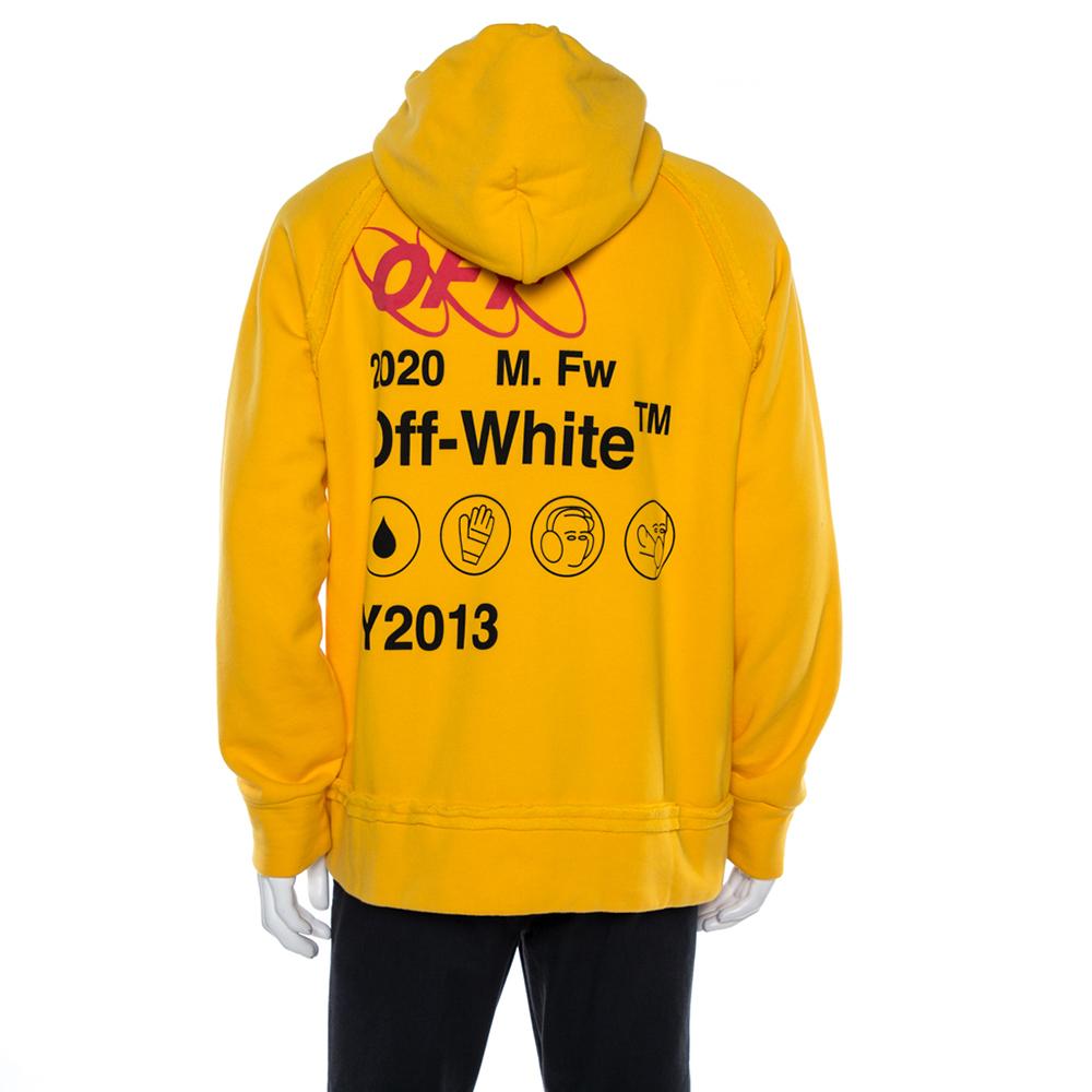This yellow-hued Off-White Industrial Y013 hoodie features a drawstring hood with a colorful dyed cord, kangaroo pocket, long sleeves, ribbed trims, and raw seam details. Made from cotton, it features Industrial logo prints at the back and front.

