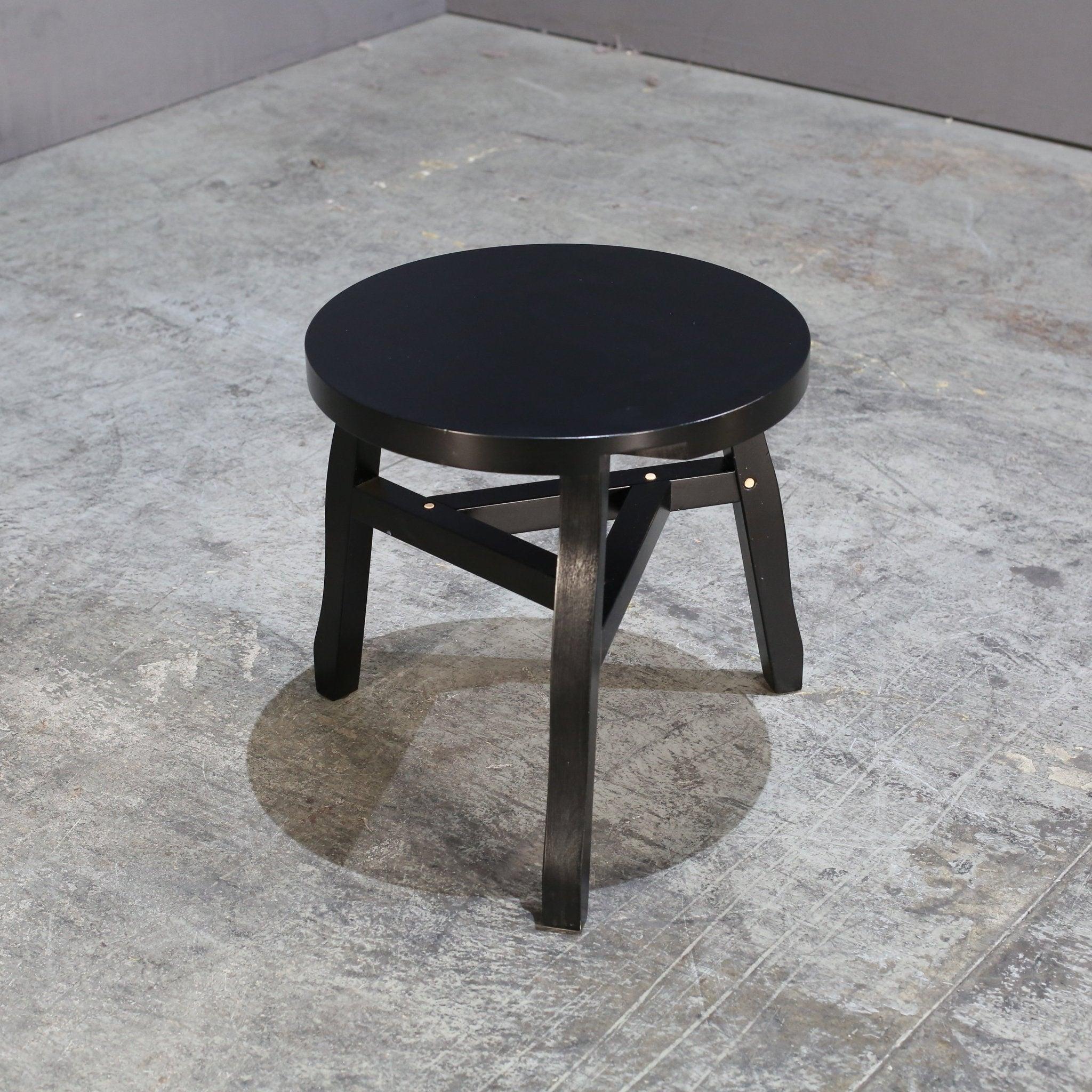 Introducing the Offcut Side Table by renowned designer Tom Dixon, a true statement piece for any luxury living space. Crafted from solid wood, this unique table features a striking geometric design with a playful twist. The natural variations in the