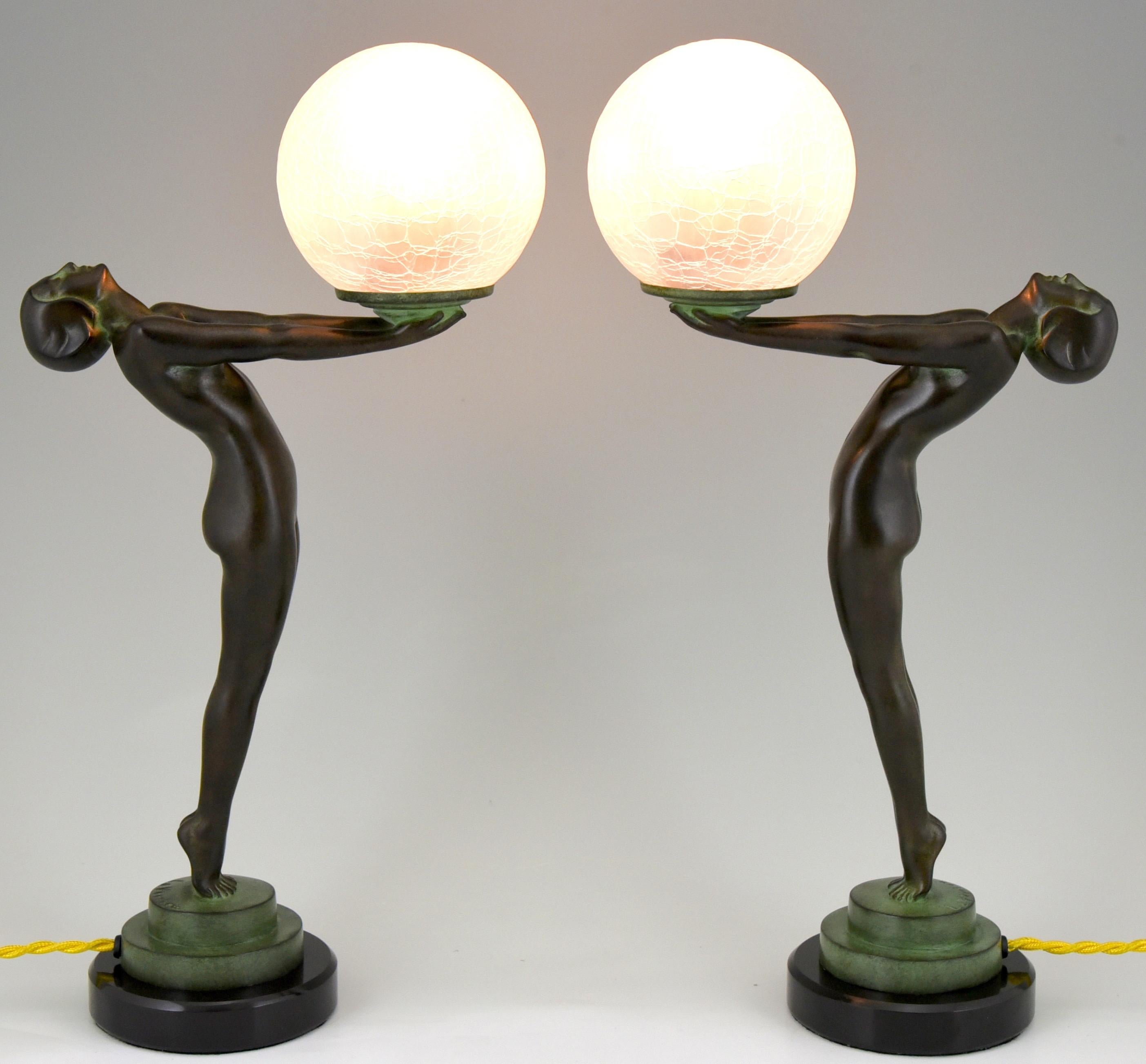 A PAIR of Art Deco style figural table lamps of a standing nude lady holding a glass globe.
This model is called Lueur lumineuse and is the smaller version of the iconic Clarté lamp by Max Le Verrier.
The lamp is signed and has the Le Verrier