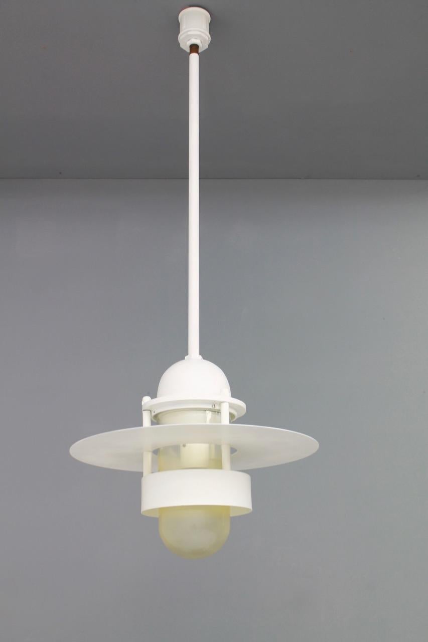 One Industrial style metal and acrylic Albertslund pendant with a long rod
The metal i overalls new painted, the acrylic glass has age-related discoloration. 

Price is per item. Ten + pendants are available

Measurements: Diameter 46 cm (18.11