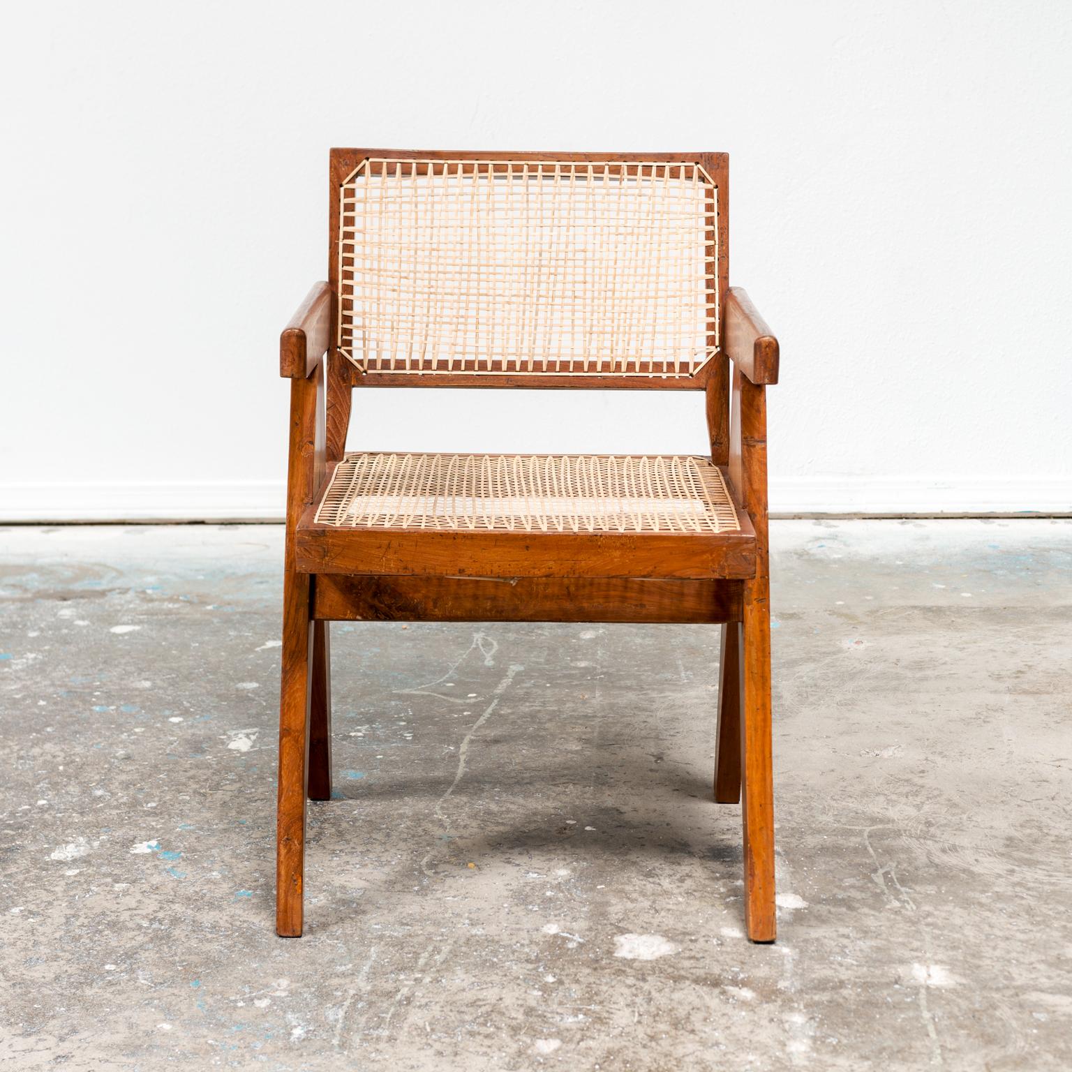 An iconic office armchair by Pierre Jeanneret for the administration buildings in Chandigarh, India, 1950s. In teak and cane.