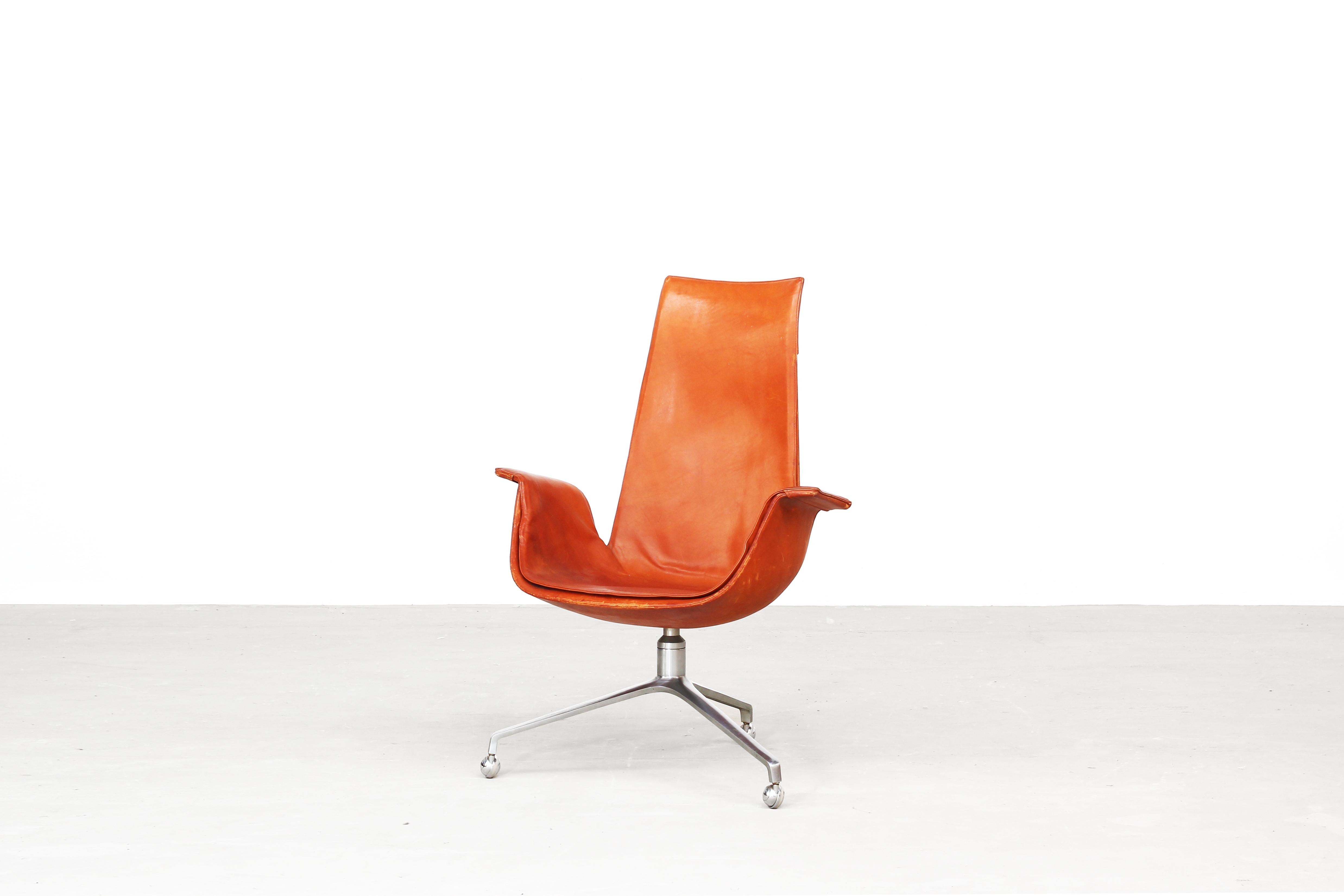 Original Tulip chair, as office chair, designed by Fabricius & Kastholm and produced by Alfred Kill International in the late 60ies in Germany. The chair comes in an original condition with patinated leather in brown cognac. Beautiful condition with