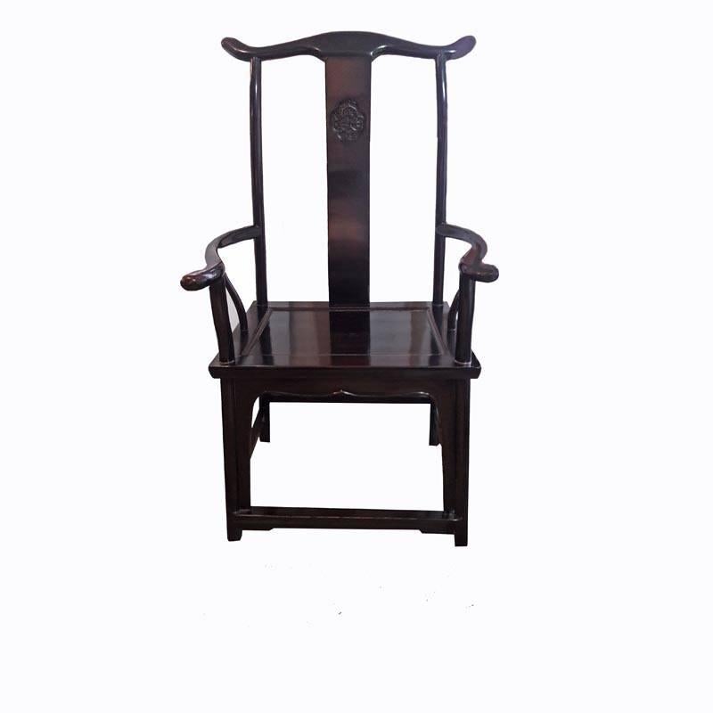 Official's Hat armchairs in polished elmwood. Zheijan, late 20th century. Well-carved, curved crest rail supported on a narrow S-shaped splat, with a hand-carved Chinese decoration. Smoothly curved rear posts which continue to form the rear legs.