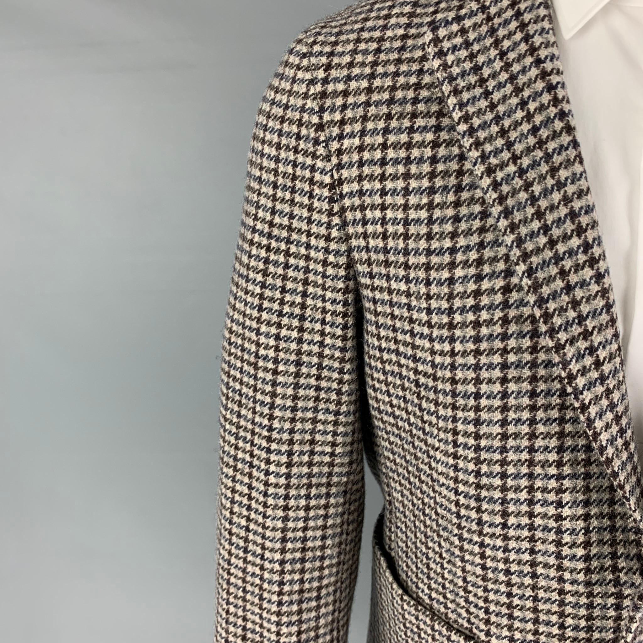 OFFICINE GENERALE sport coat comes in a grey & brown plaid wool featuring a notch lapel, patch pockets, single back vent, and a double button closure. 

Excellent Pre-Owned Condition.
Marked: 48

Measurements:

Shoulder: 17 in.
Chest: 38 in.
Sleeve: