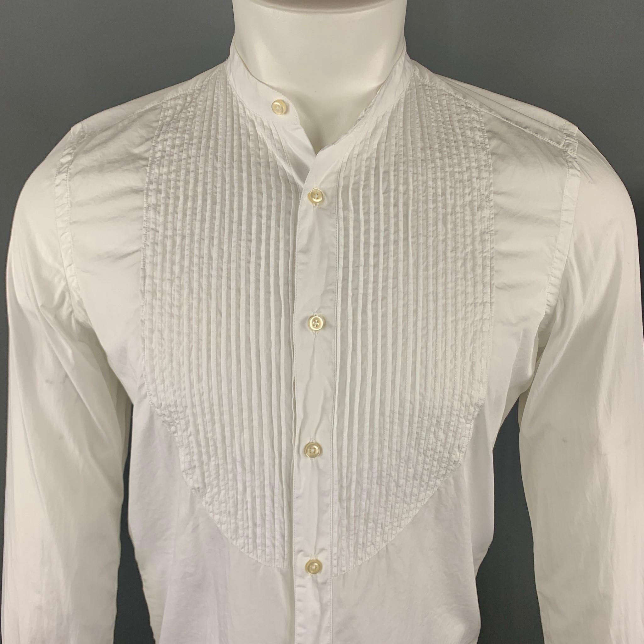 OFFICINE GENERALE Long Sleeve Shirt comes in a white solid cotton material, with a nehru collar, a pleated front, buttoned cuffs, button up. Made in Portugal.

Excellent Pre-Owned Condition.
Marked: S

Measurements:

Shoulder: 16 in. 
Chest: 41 in.