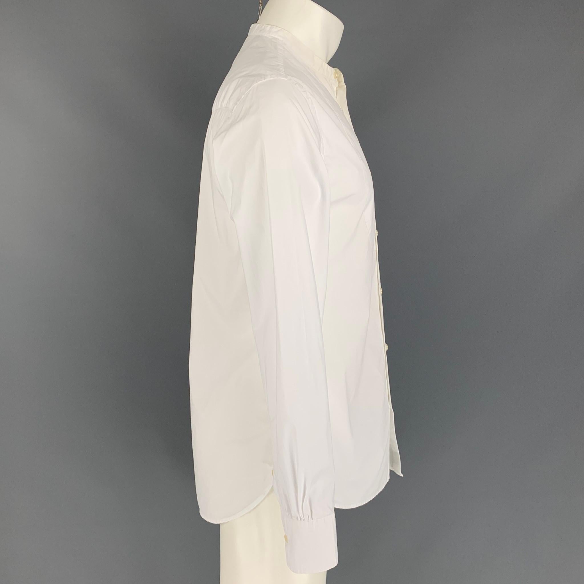 OFFICINE GENERALE x BARNEY'S NEW YORK long sleeve shirt comes in a white cotton featuring a nehru collar and a buttoned closure. Made in Portugal.

Very Good Pre-Owned Condition.
Marked: M

Measurements:

Shoulder: 17 in.
Chest: 40 in.
Sleeve: 25.5