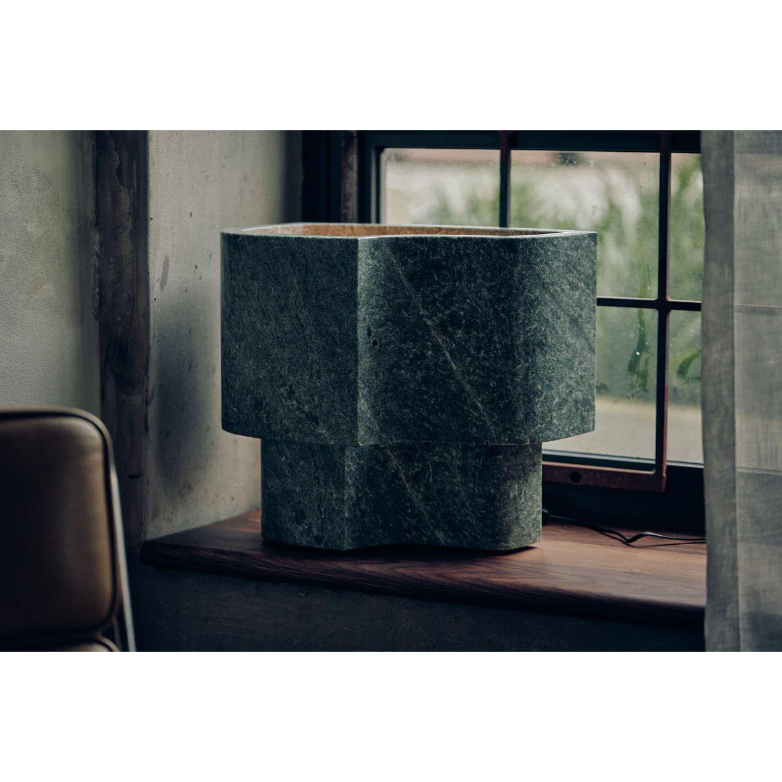 Verde Offset Lamp by Henry Wilson
Dimensions: W 44.5 x D 30 x H 39 cm
Materials: Verde Marble

Offset Lamp is hewn from two pieces of solid Verde Marble. As stone is a natural material, variations of the pattern will occur from piece to piece.
Emits