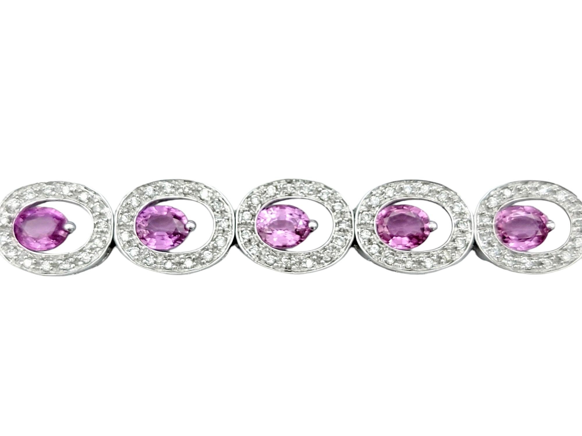 Contemporary Offset Pink Sapphire and Diamond Halo O-Link Bracelet in 14 Karat White Gold For Sale