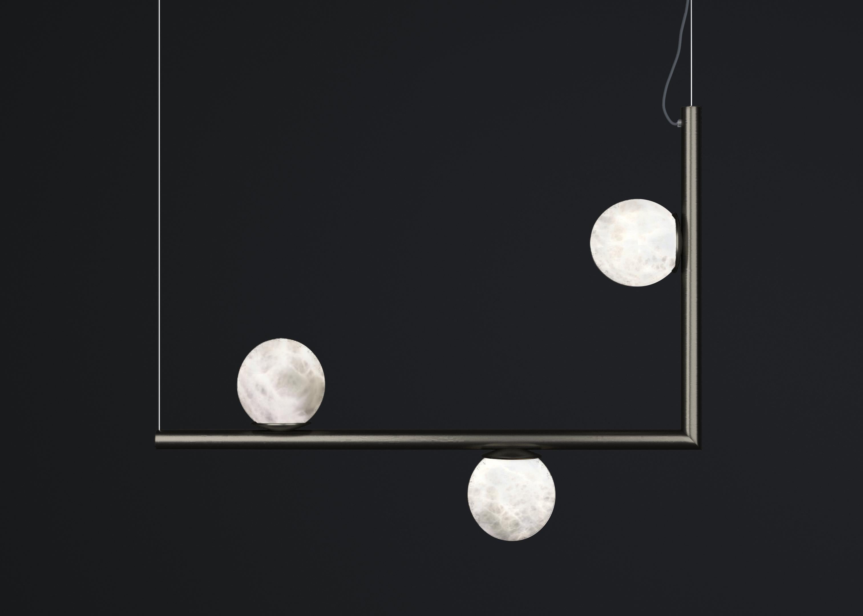 Ofione 1 Brushed Black Metal Pendant Lamp by Alabastro Italiano
Dimensions: D 15 x W 85 x H 64 cm.
Materials: White alabaster and metal.

Available in different finishes: Shiny Silver, Bronze, Brushed Brass, Ruggine of Florence, Brushed Burnished,