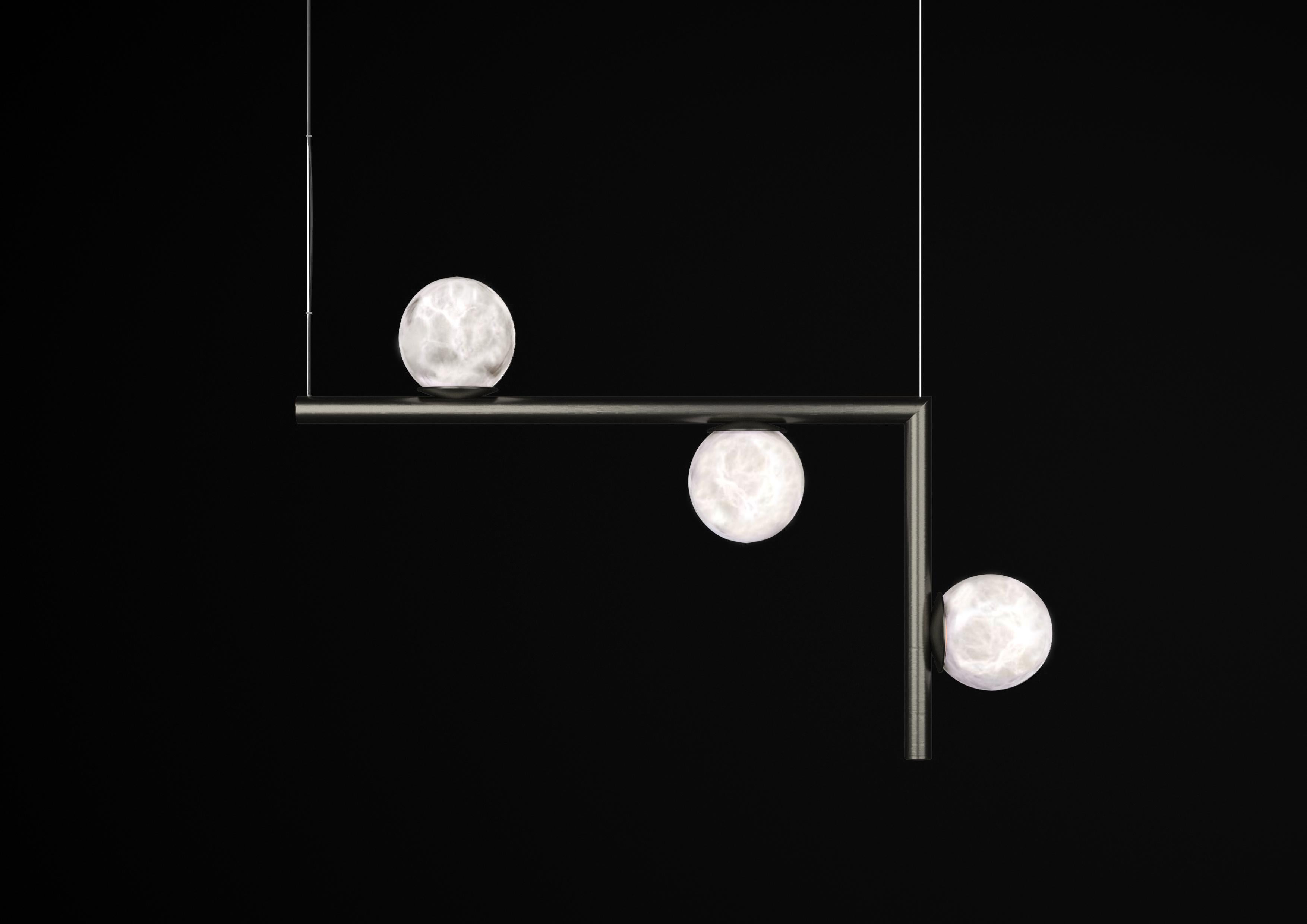Ofione 2 Brushed Black Metal Pendant Lamp by Alabastro Italiano
Dimensions: D 14 x W 85 x H 55 cm.
Materials: White alabaster and metal.

Available in different finishes: Shiny Silver, Bronze, Brushed Brass, Ruggine of Florence, Brushed Burnished,