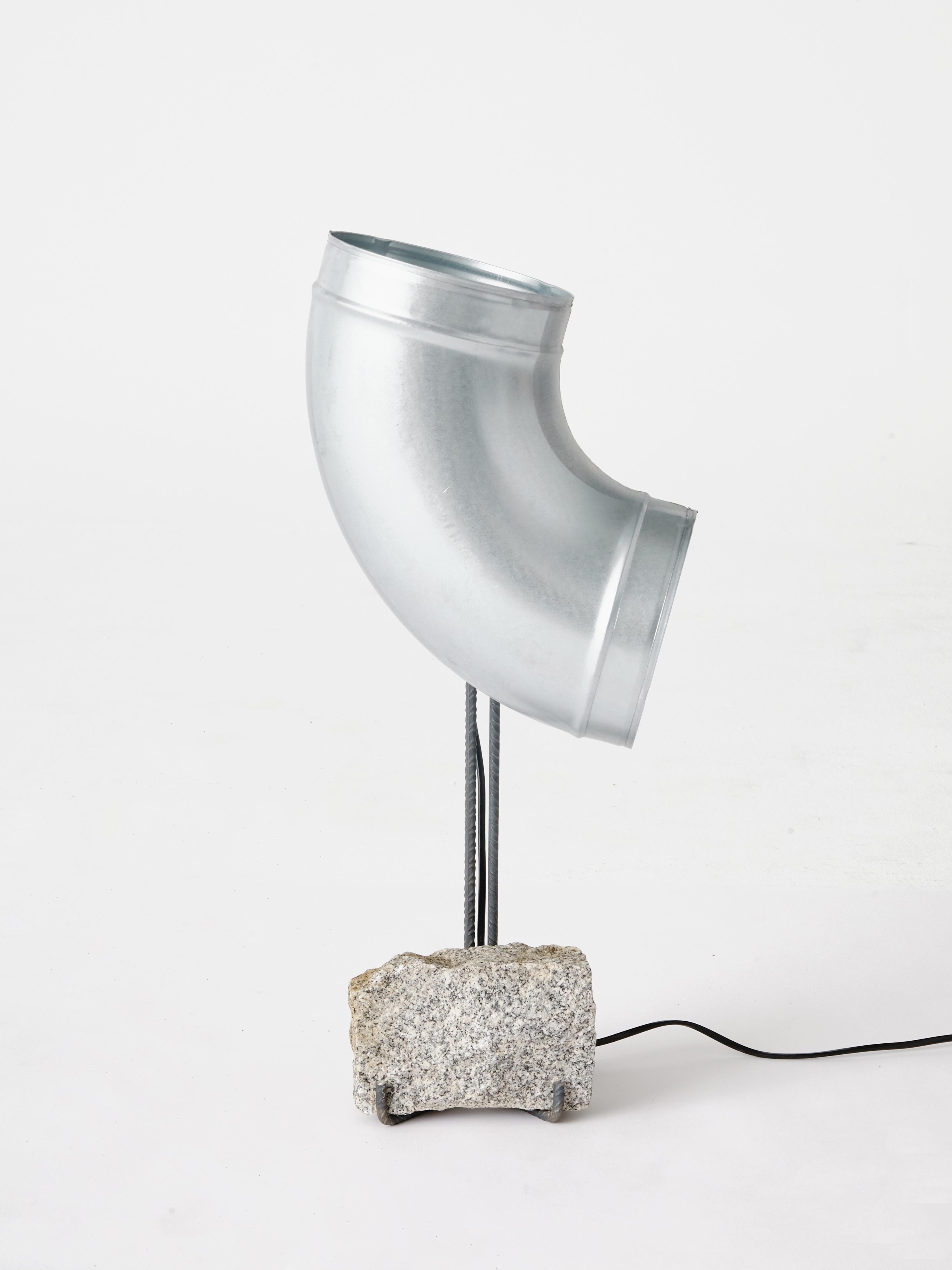 This 'Pipe, Rod and Brick' tubular steel table lamp forms part of the Series O.F.I.S (Objects From Intersticial Space), an ongoing research of industrial material's potential for narrative. Muñoz designed this Tubular Steel table as an exploration