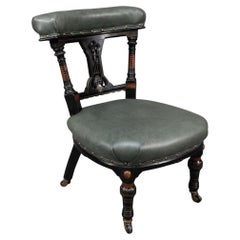 Antique Ogdens Of Manchester. An Aesthetic Movement Ebonized & Parcel Gilt Nursing Chair