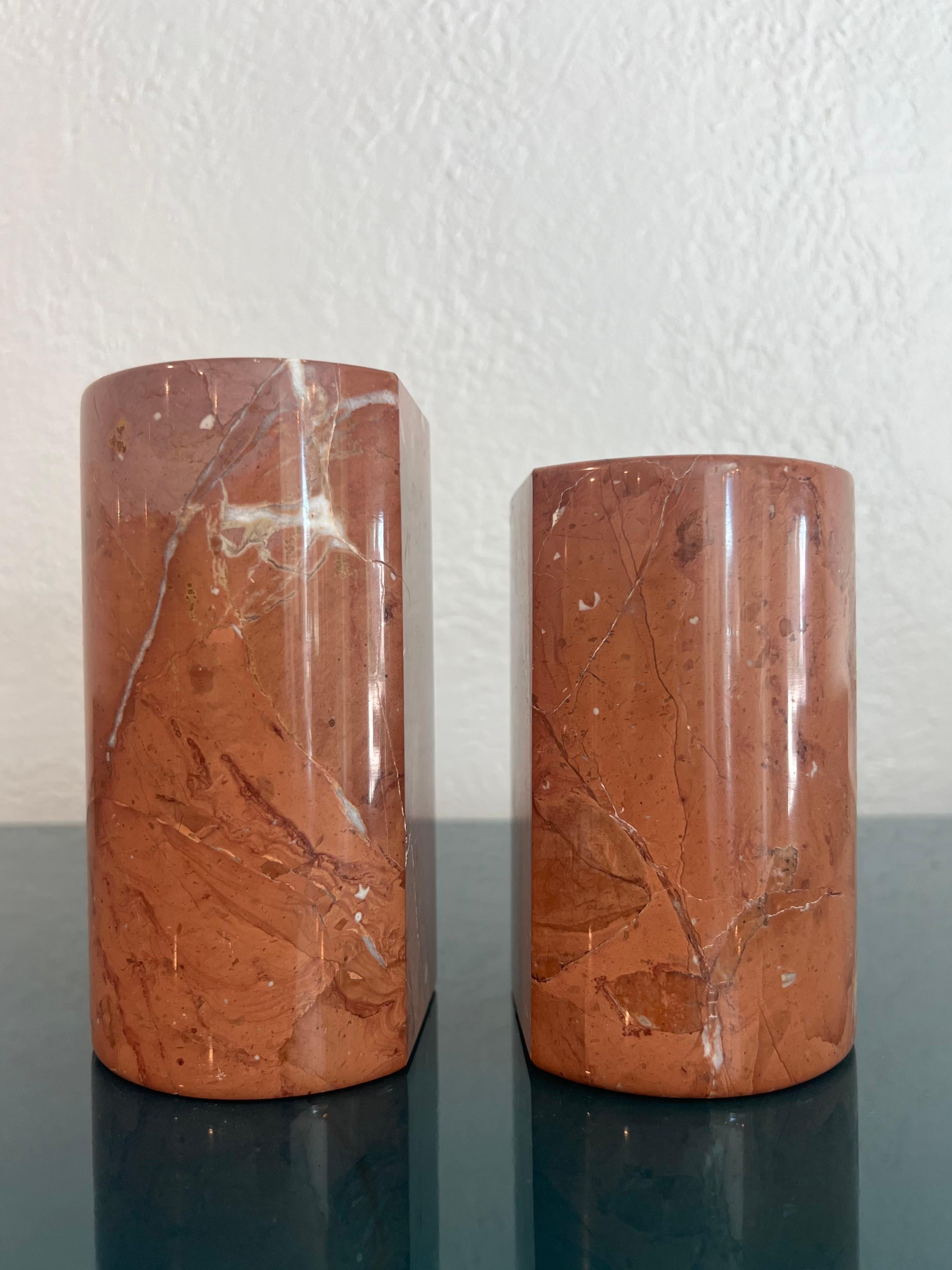 Oggetti Italian marble bookends. Brilliant veining throughout. Signed. Small chip on bottom of one (please refer to photos). Please note they are slightly different in height. One stands 5.5” high and the other stands 4 3/4” high.

Would work well