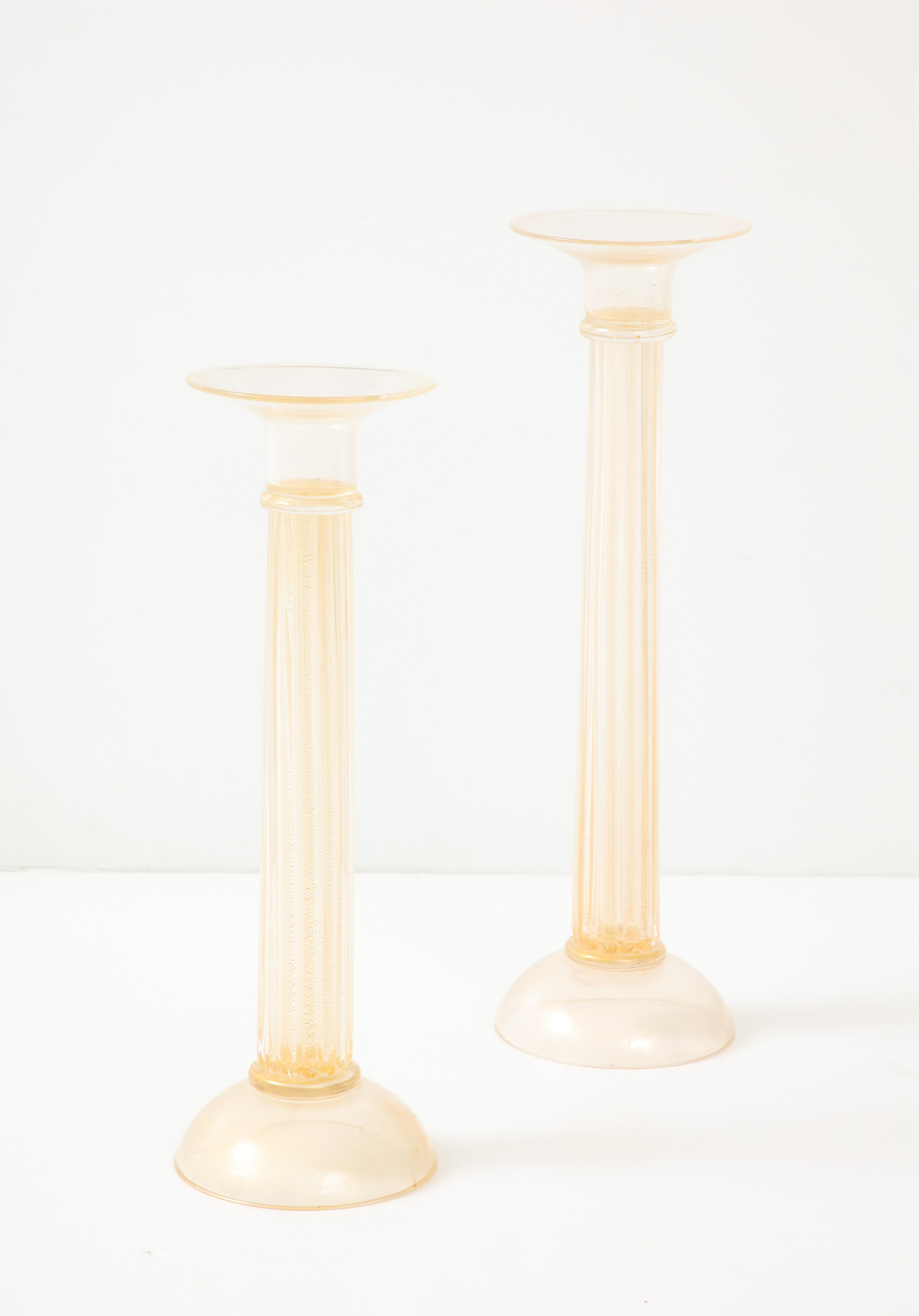 Beautiful pair of large 1980's Oggetti Italy Murano glass cnadle holders, in vintage original condition with minor wear and patina due to age and use.

Smaller candle holder height 22'' depth 7.25''