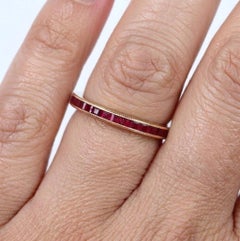 Princess Cut Ruby Eternity Band in 18k Yellow Gold