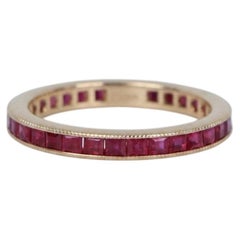 Princess Cut Ruby Eternity Band in 18k Yellow Gold