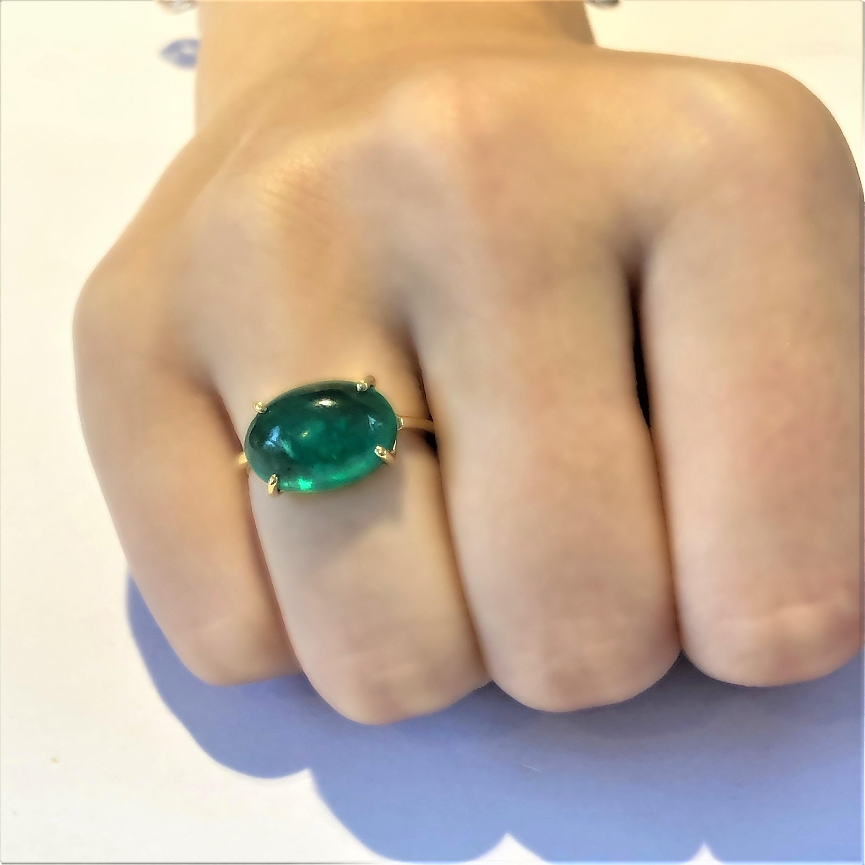 Eighteen Karats yellow gold emerald ring 
Cabochon emerald weighing 6.70 carat       
Emerald measuring 14x12 millimeter                                                        
Ring size 5 In Stock
The ring can be resized 
New Ring
Handmade in the