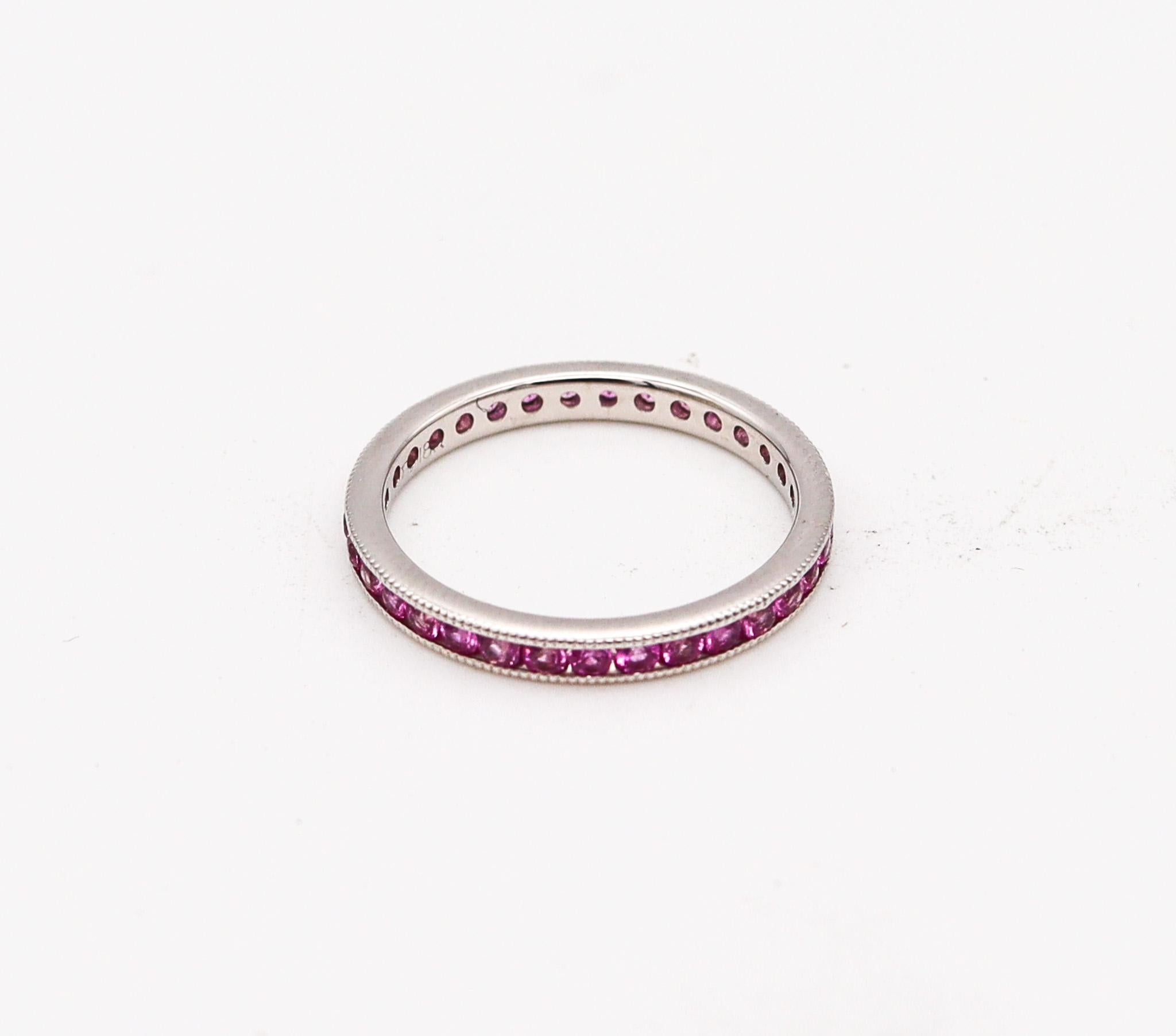Modern Ogi Eternity Band Ring in 18kt White Gold with 1.40ctw in Vivid Pink Sapphires For Sale