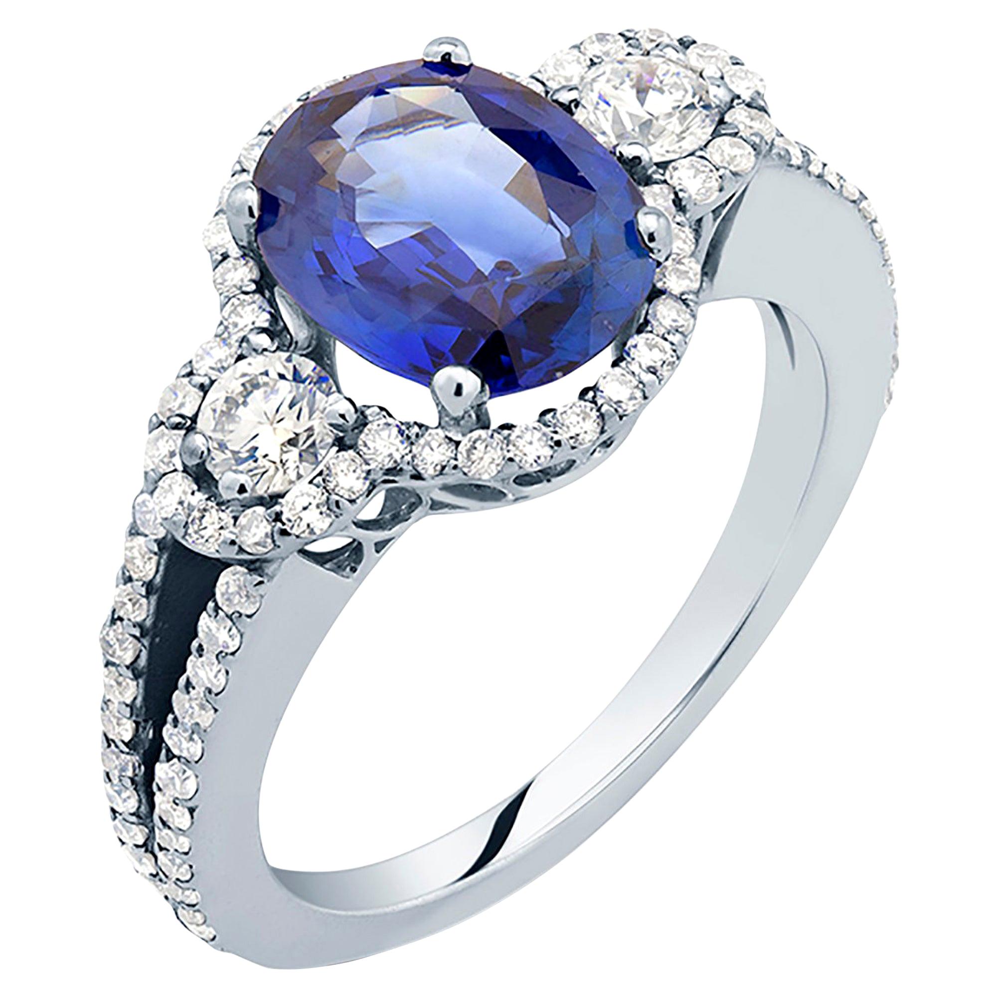 Eighteen karats white gold one of a kind cocktail ring
Oval shape sapphire weighing 2.80-carat  
Two matched round diamonds side stone weighing 0.25 carat
Surrounded by pave-set diamonds weighing 1.05 carat  
Diamond quality G VS. 
New ring 
Ring