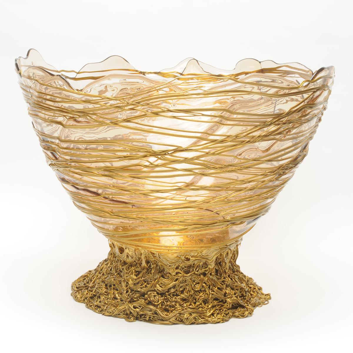 Ogiva basket - clear, gold

Basket in soft resin designed by Gaetano Pesce in 1995 for Fish Design collection.

Additional Information:
Material: Soft resin
Colours: Clear, gold
Dimensions: c.a ø 50cm x H 35cm 
Available in other size