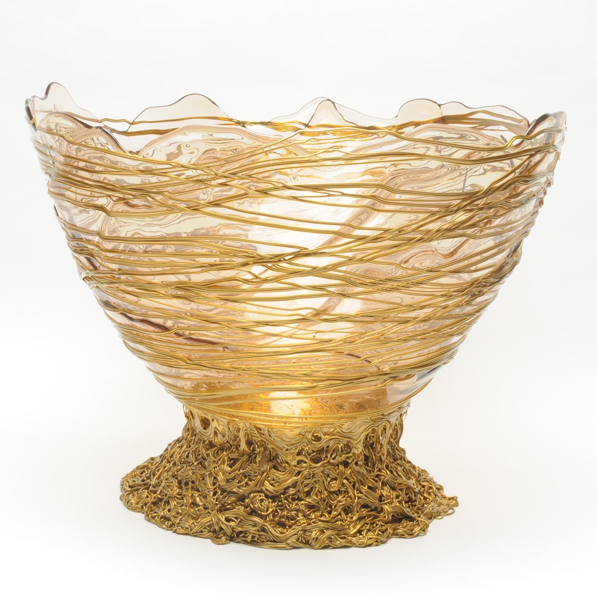 Ogiva basket - clear, gold

Basket in soft resin designed by Gaetano Pesce in 1995 for Fish Design collection.

Additional Information:
Material: Soft resin
Colours: Clear, gold
Dimensions: c.a ø 44cm x H 25cm
Available in other size