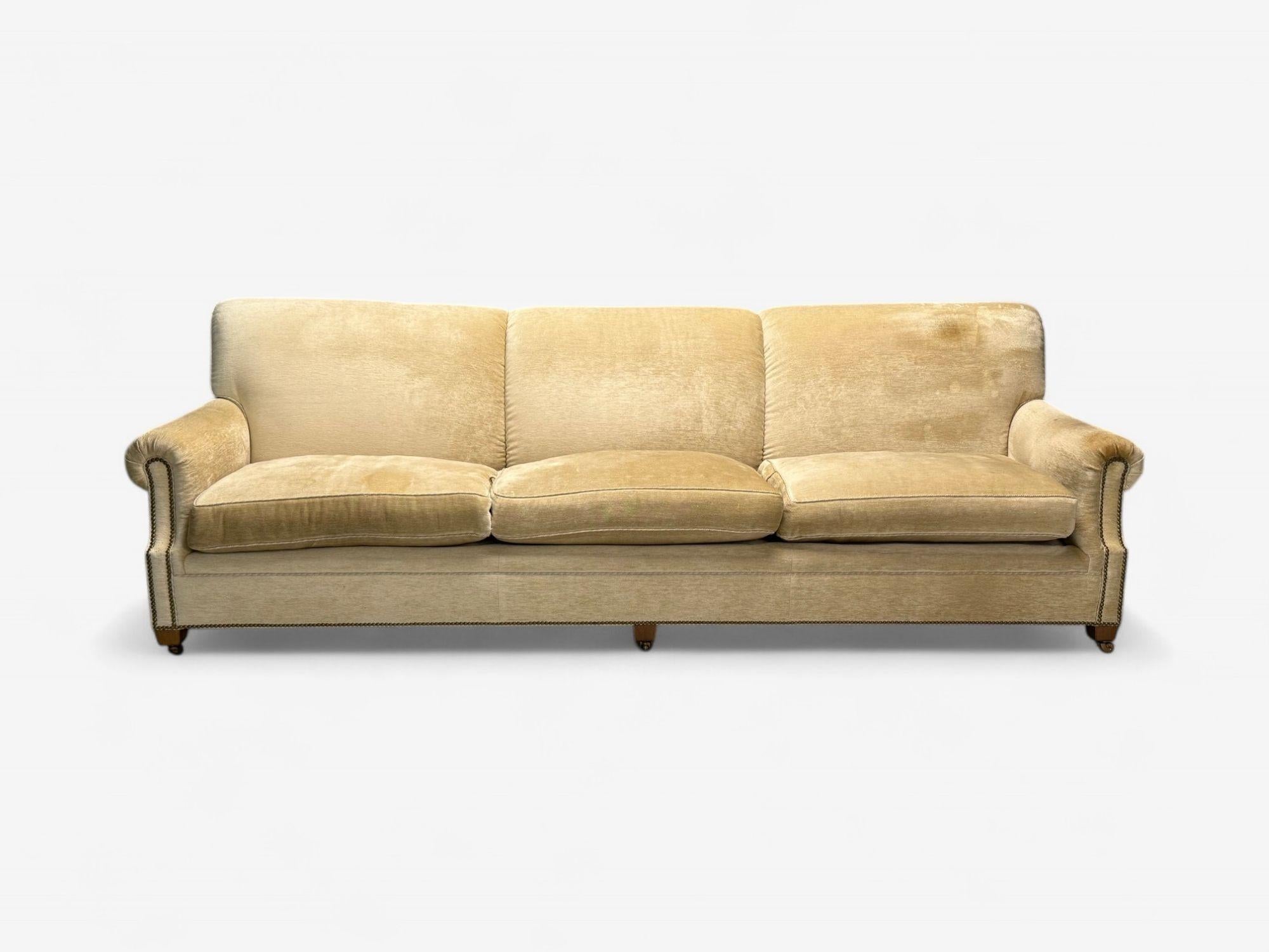 O’Henry House, Traditional Sofa and Ottoman, Velvet, USA, 2000s

A monumental sofa by O Henry House in the Georgian taste having large rolled arms with tacked fronts with removable cushions on boxed brass legs on casters. Fine Chenille upholstery,