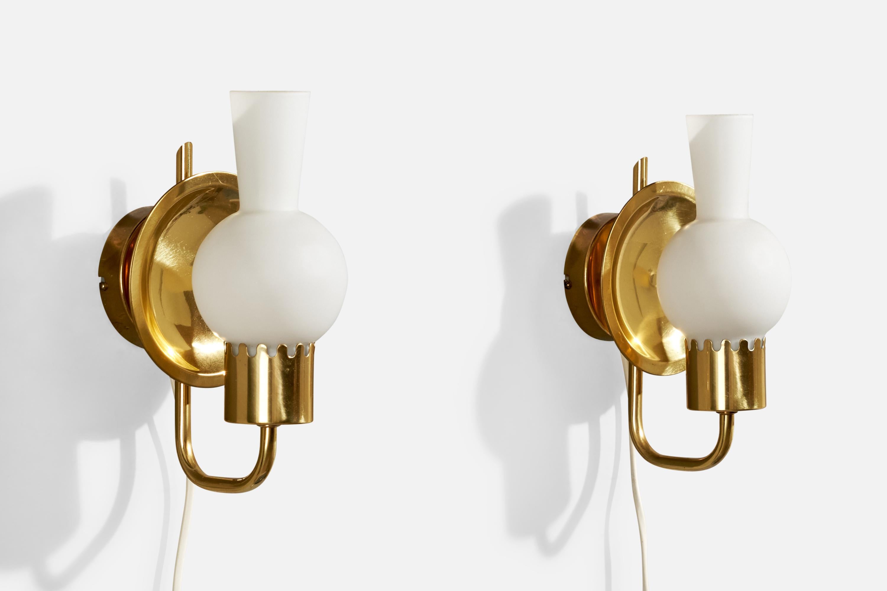 A pair of brass and white opaline glass wall light designed and produced by ÖIA, Sweden, c. 1970s.

Overall Dimensions (inches):  9.5” H x  5” W x  5.875“ D

Back Plate Dimensions (Inches):  3.25” H x 3.25” W x 1” D

Bulb Specifications: