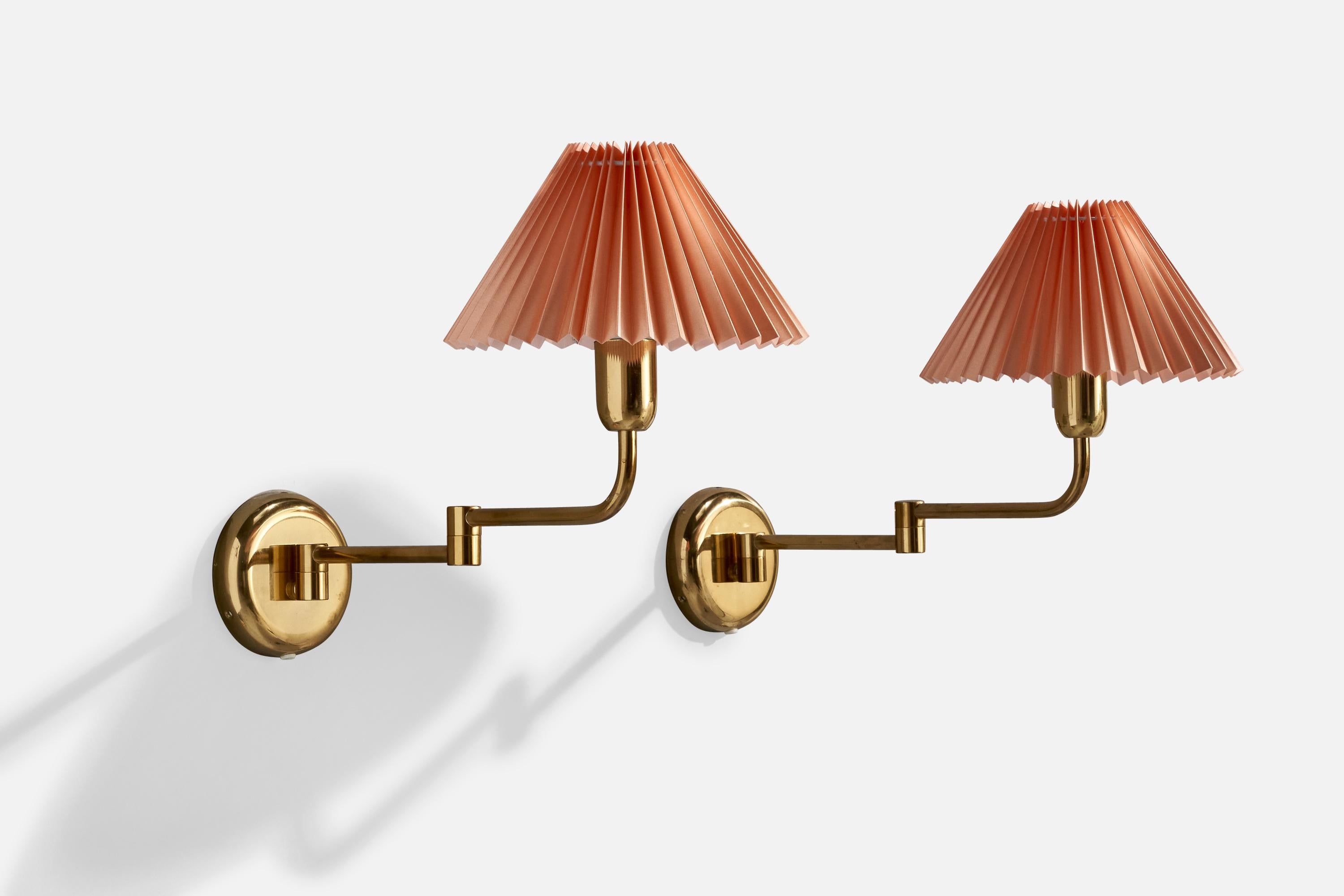 A pair of brass and paper wall lights produced by ÖIA, Sweden, c. 1970s.

Overall Dimensions (inches):  14.5” H x  10 ” W x  21.25” D

Back Plate Dimensions (Inches): 5  ” H x 5 ” W x 1” D

Bulb Specifications: E-26 Bulb

Number of Sockets (per