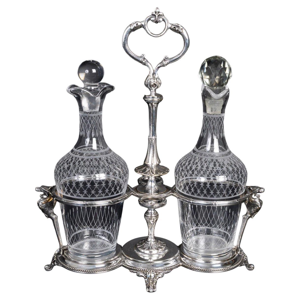 Aceitera y vinagrera de metal plateado y cristal, S. XIX. en venta
