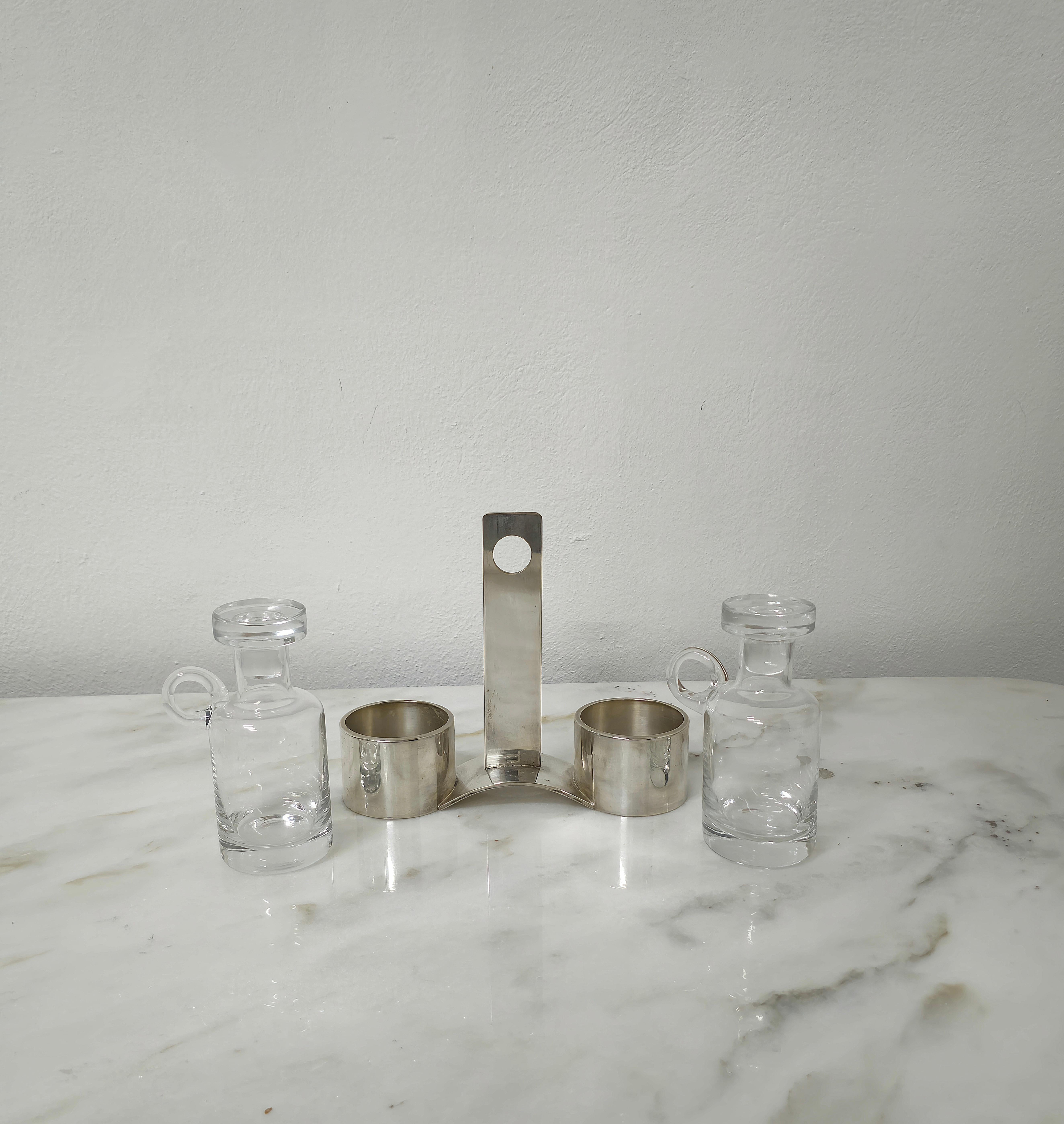 A masterfully designed modernist oil and vinegar cruet set of impeccable quality made of glass and silver plate , Italy, 1970s. In great condition with some minor wear.

Weight: 1.035 Kg

NOTE: We offer our customers an excellent and professional