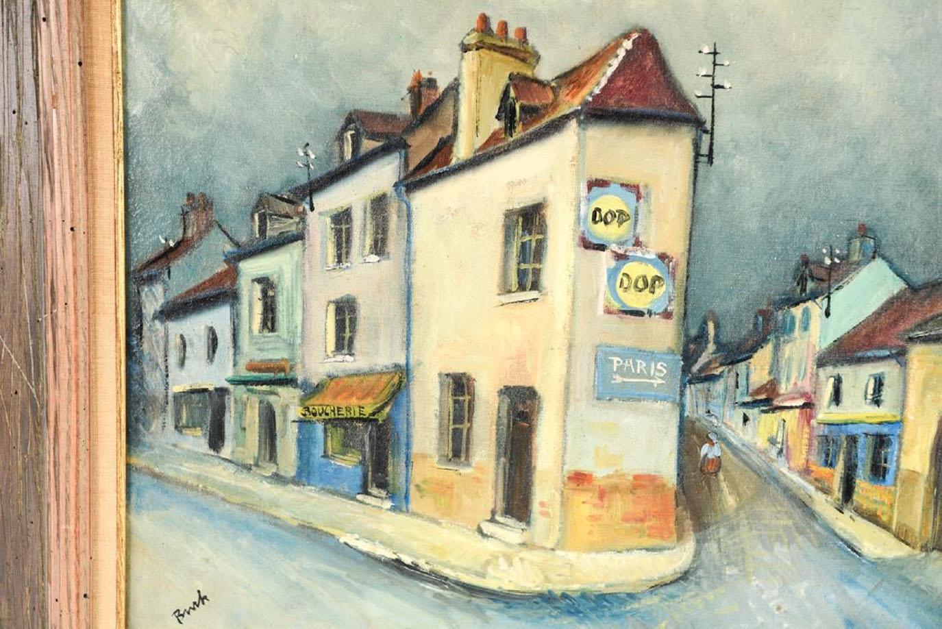 The painting depicting a French provincial town is signed by the artist George Brainerd Burr, (American 1876-1939). The scene focuses on buildings lining two streets branching away from each other. The building in the foreground has a sign