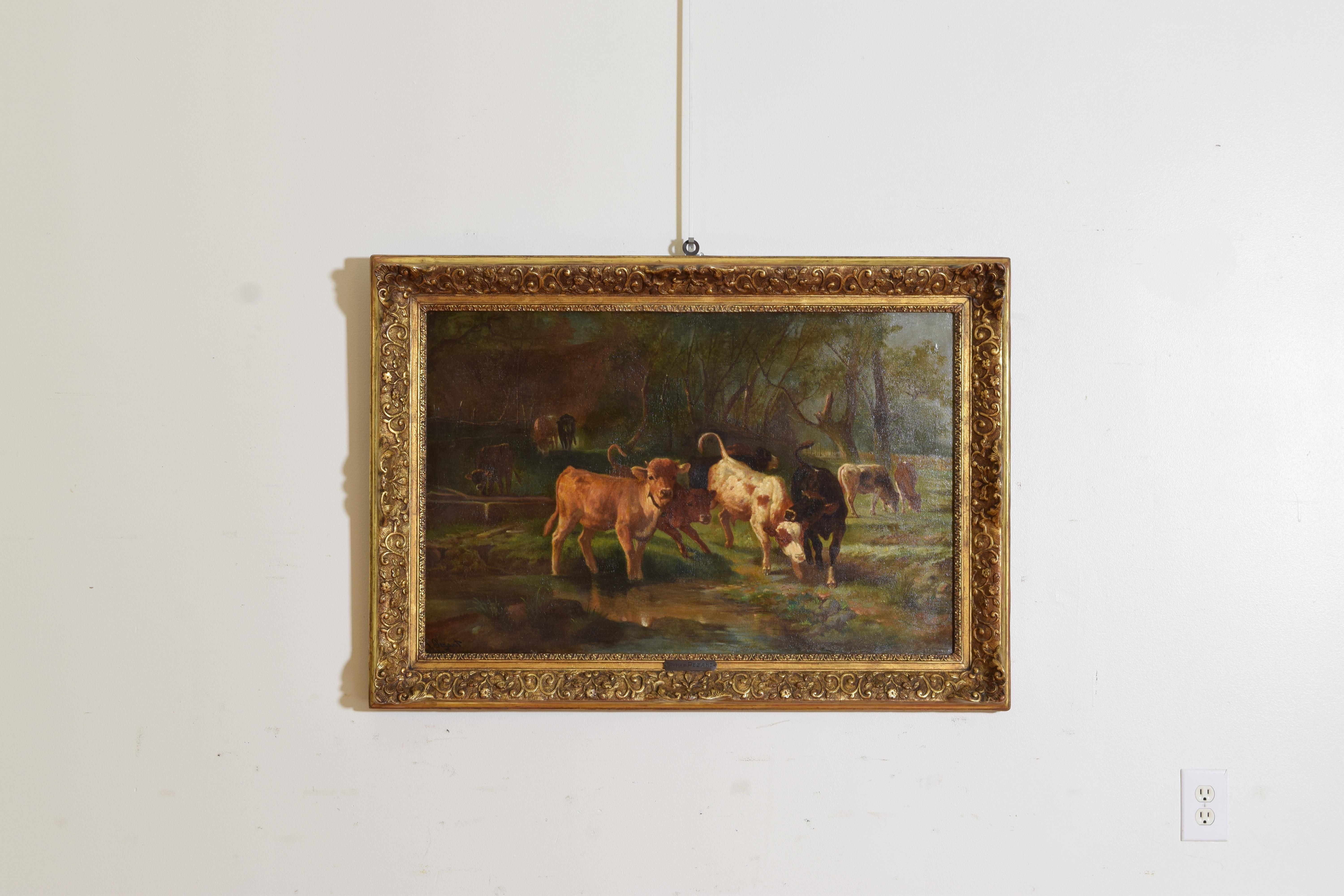 A scene of cows around a stream watering and at play surrounded by a low forest and meadows, the lead cow gazing directly at the viewer, in its original gilt-gesso frame complete with artist’s nameplate