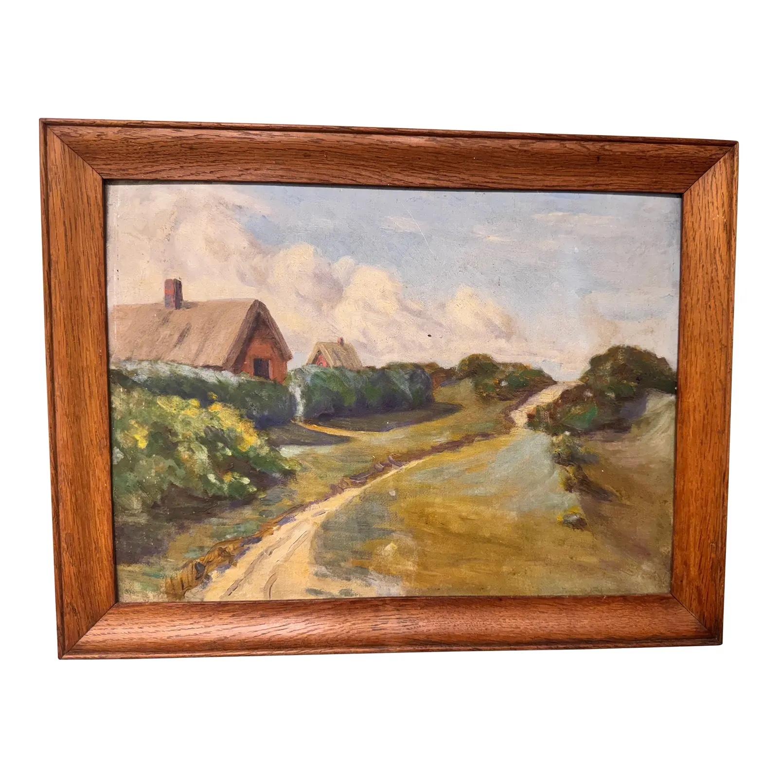 This 19th-century English oil original paintingis perfect for a farmhouse, rustic, or scenic-inspired room in your living space. It depicts a barn alongside a dirt road, with another peeking through the trees behind it, leading towards a hill.
