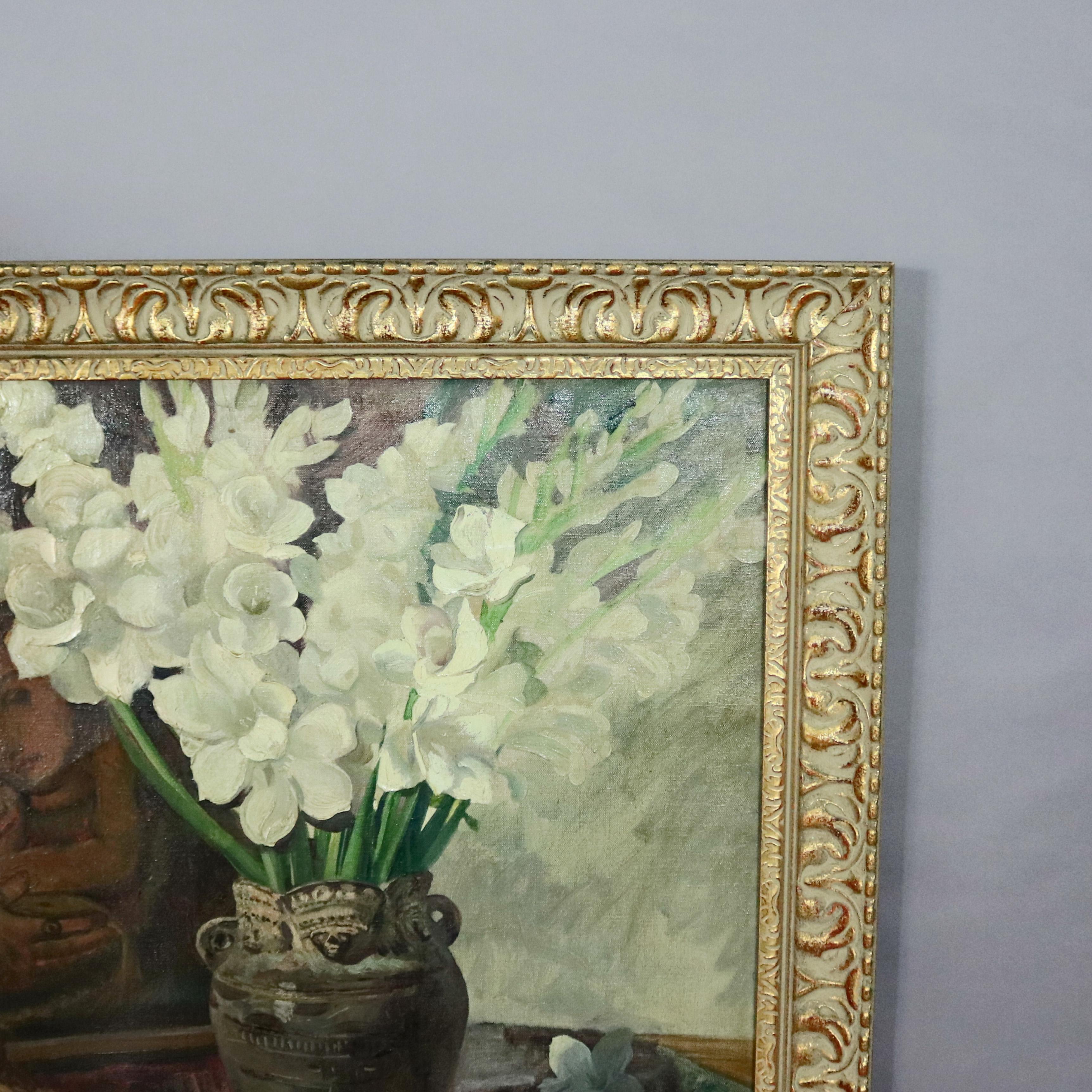 An oil on canvas floral still life painting by William Edward Bloomfield Starkweather offers interior scene with bouquet of gladiolas displayed in table top vase in foreground and background with painting of Mother Mary and Christ Child, signed and